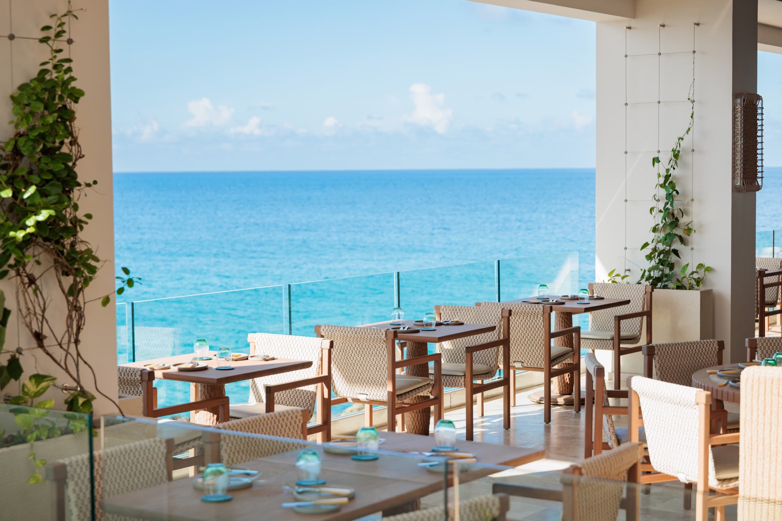 SALT restaurant terrace tables over the sea by day