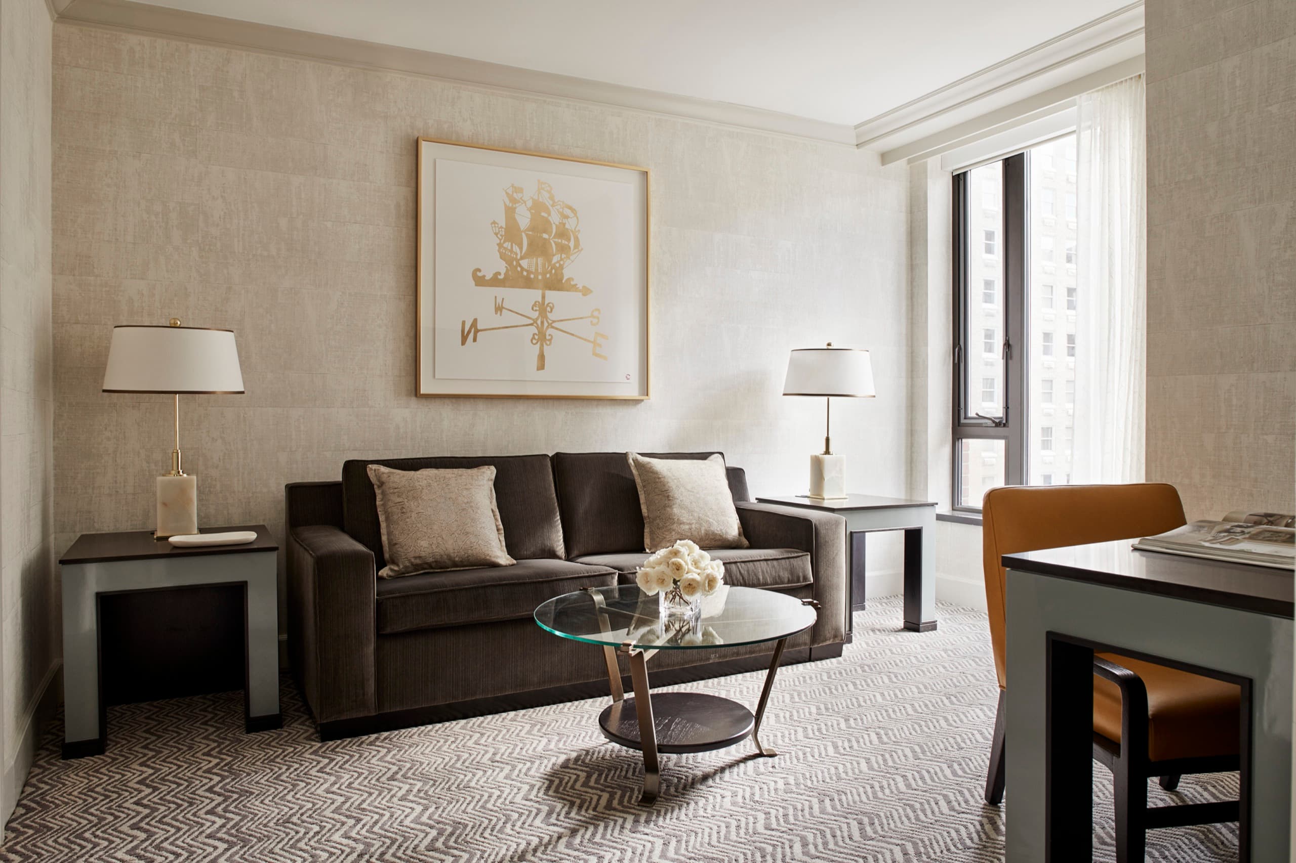 Garden View Four Seasons Executive Suite — living room with grey velvet sofa and Public Garden window