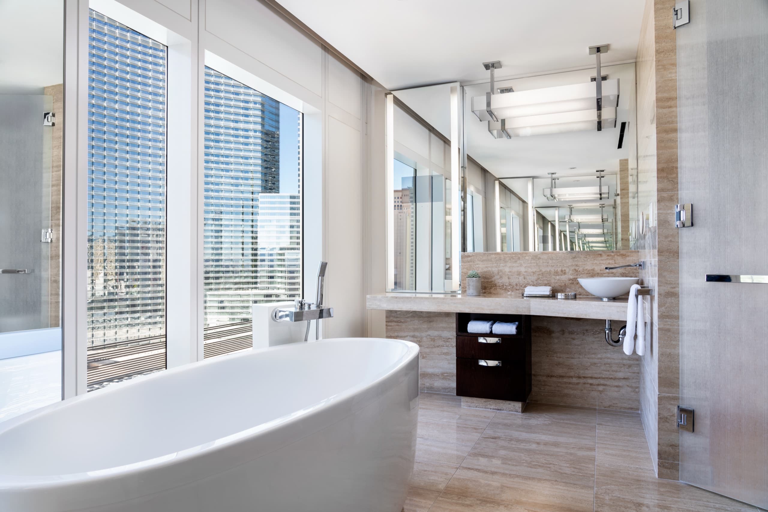 One Bedroom City View Suite - bedroom with mountain and city views (2023 redesign)