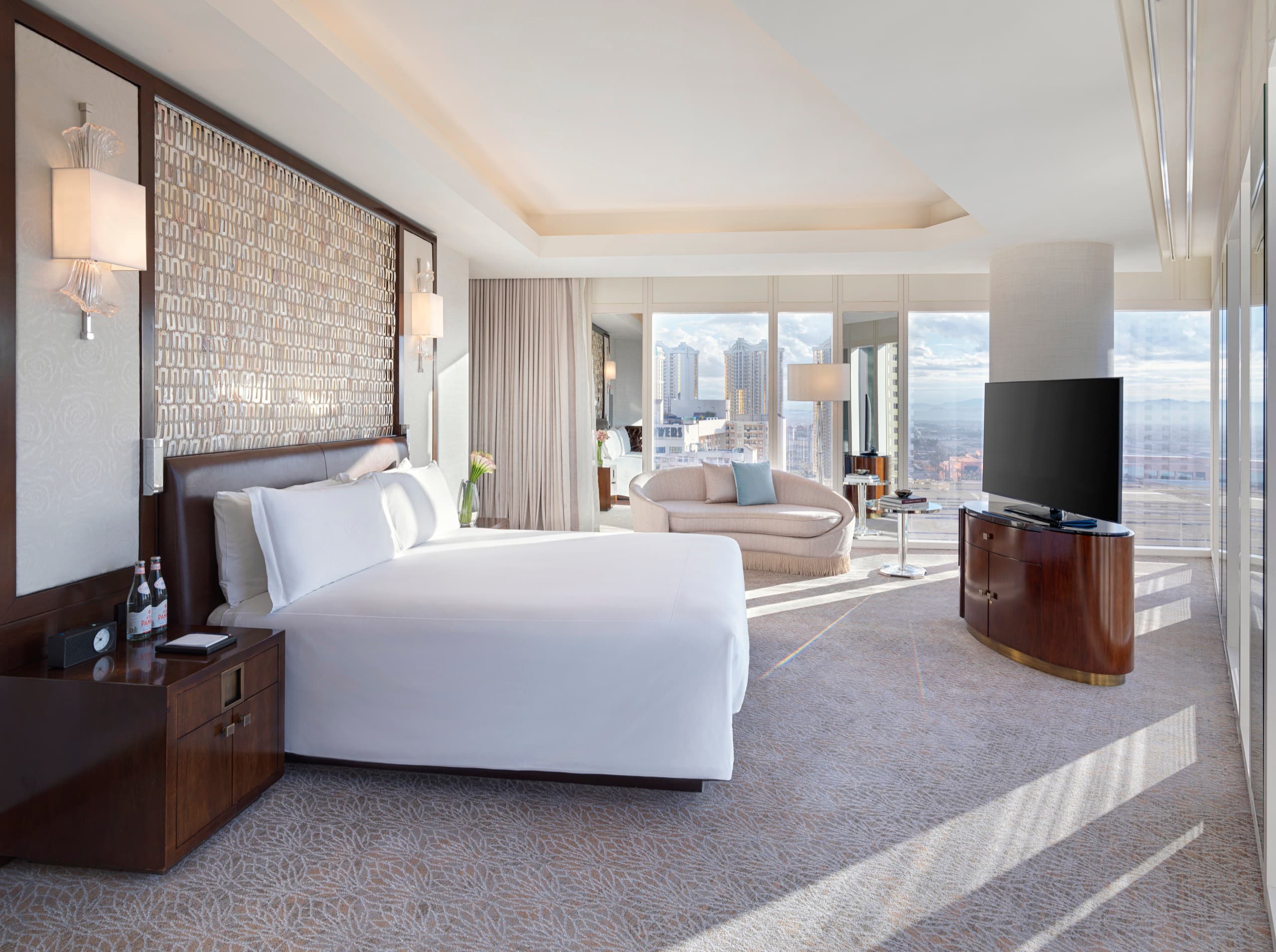 Penthouse Panorama Strip View Suite - master bedroom with wraparound windows (2024)