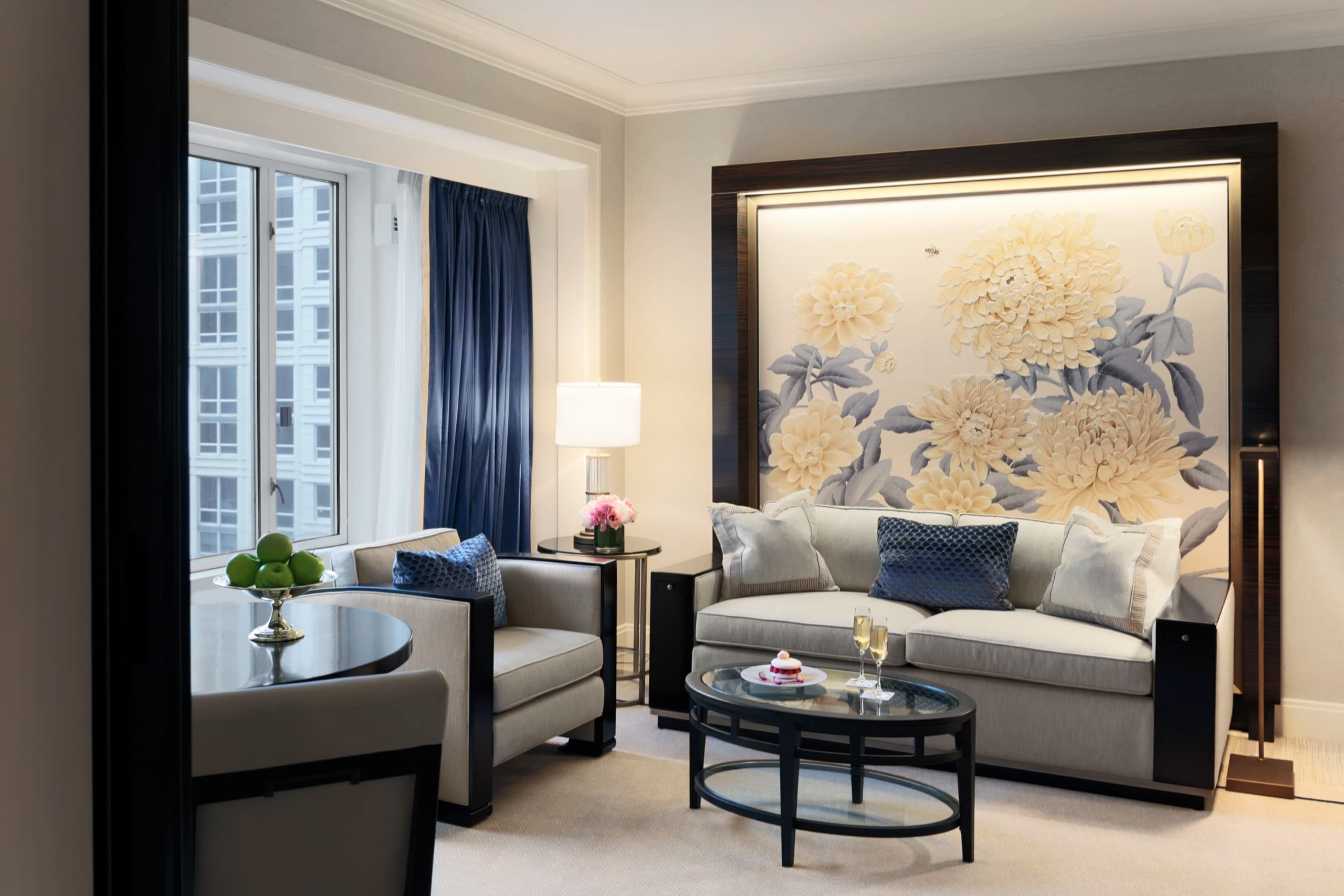 Executive Suite, entry foyer art wall opening to the parlour