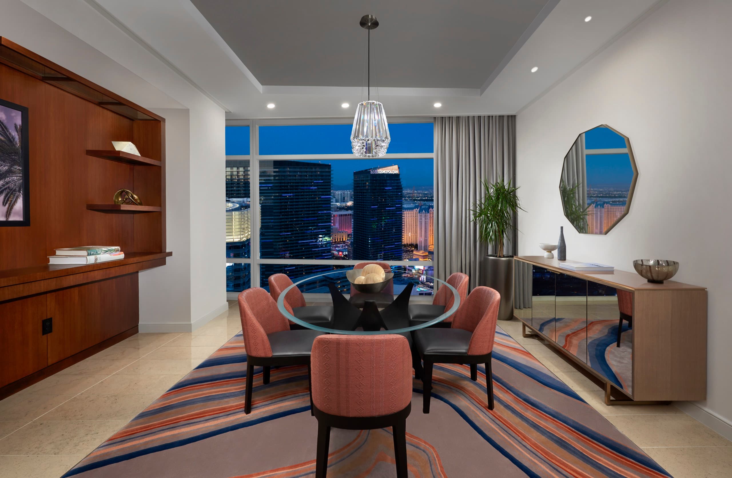 ARIA Sky Suites Two Bedroom Penthouse — dining room with Strip skyline at dusk