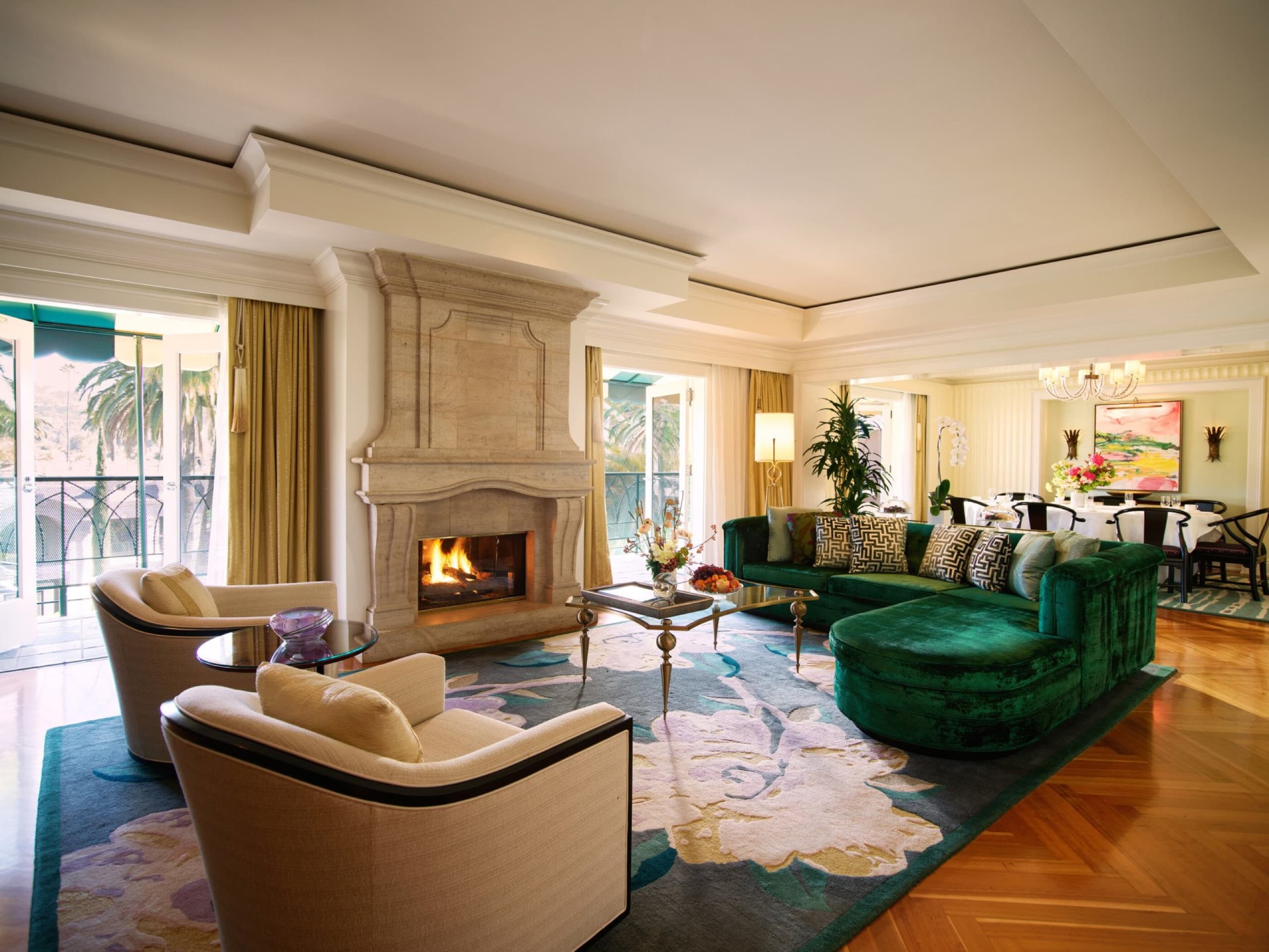 Paul R. Williams Suite (Suite 117) — living room with grand piano and stone fireplace