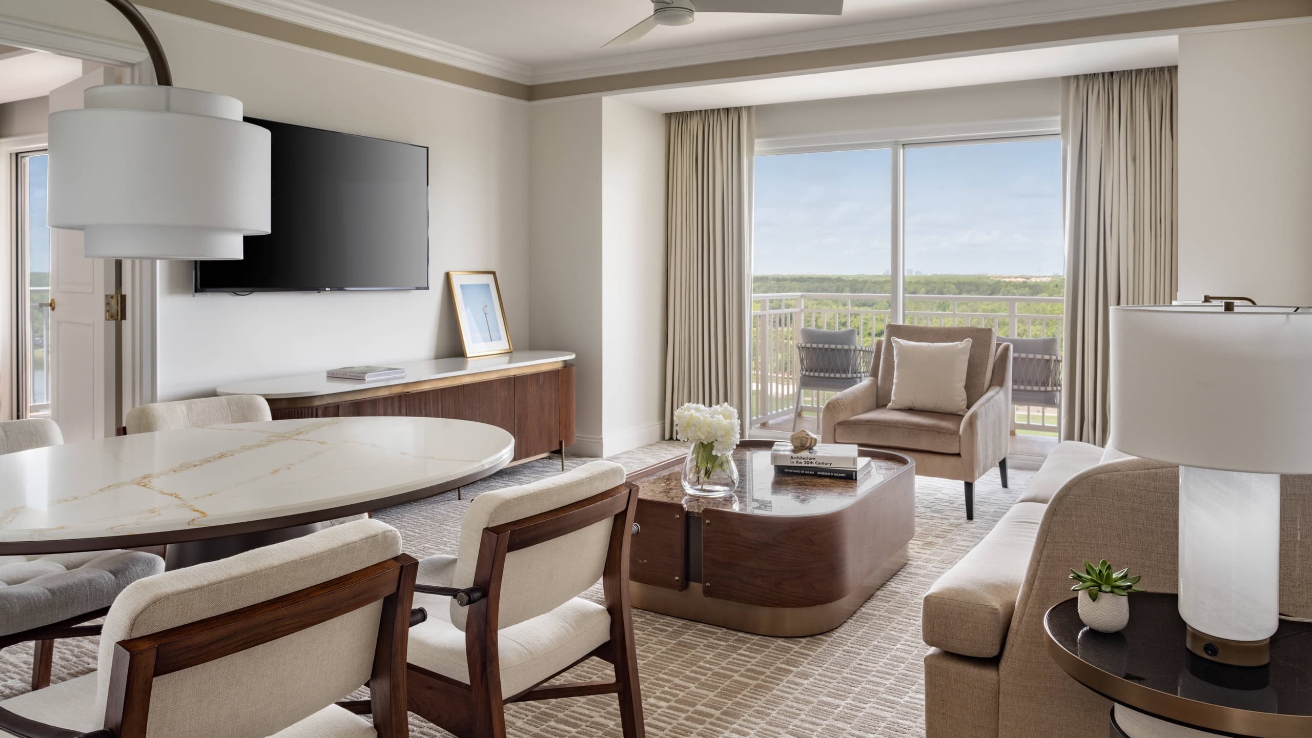 Executive Suite living and dining area with balcony (one-bedroom suite)