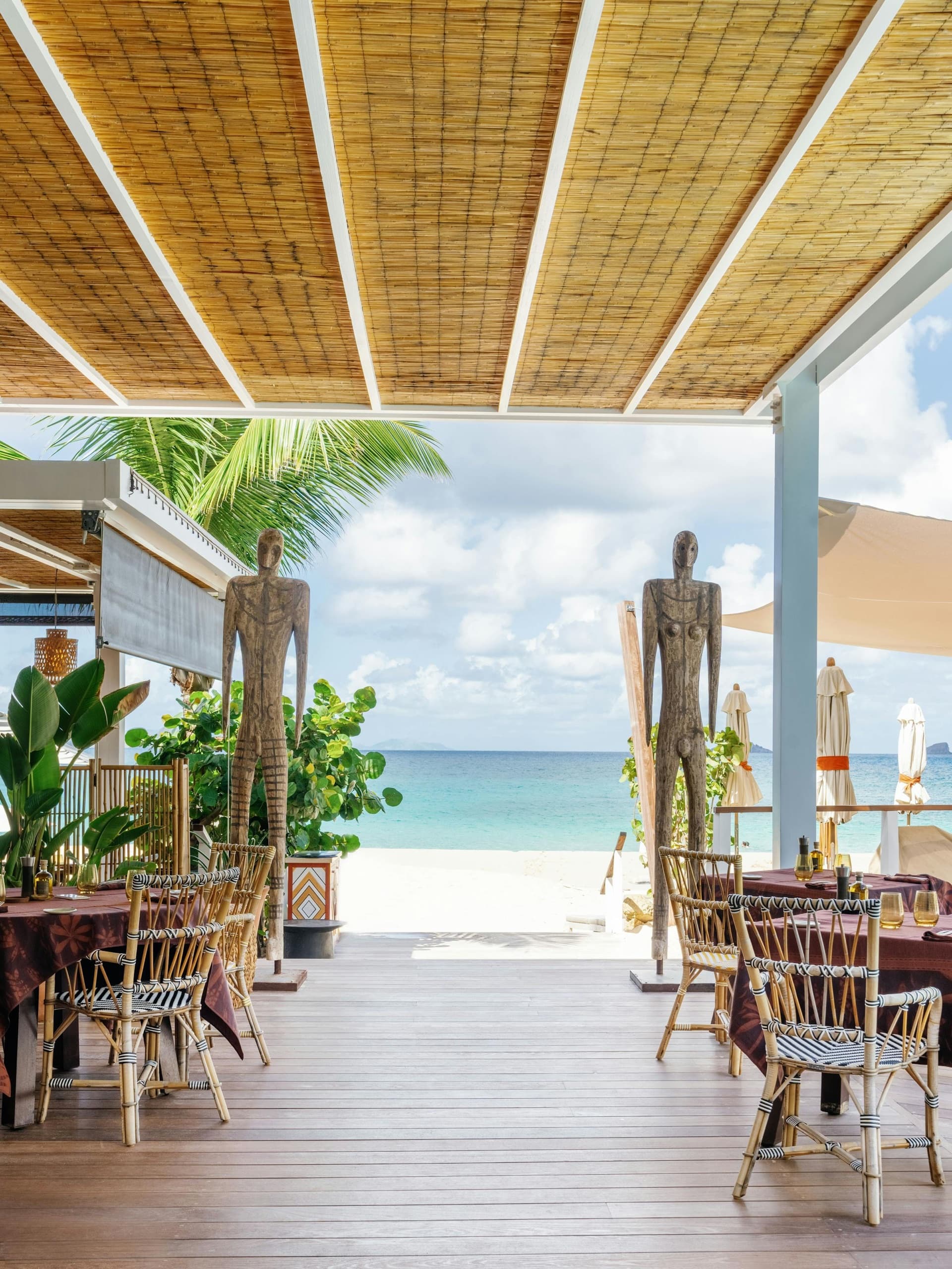 La Cabane beachfront restaurant terrace opening onto Flamands beach