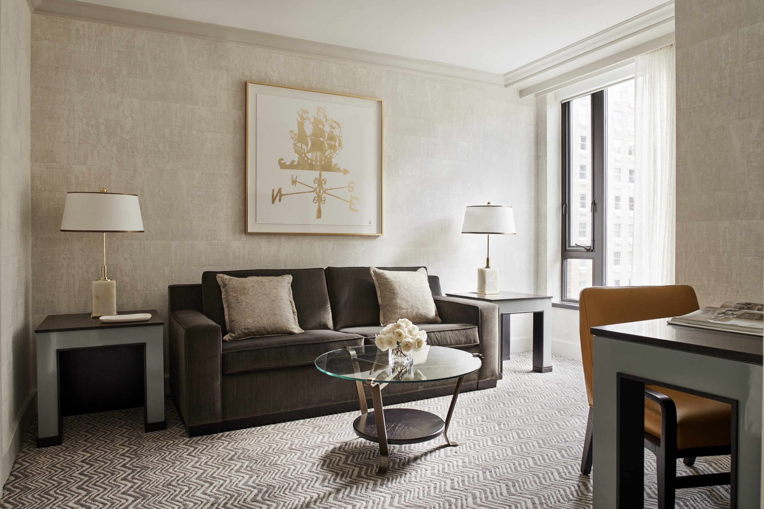 Garden View Four Seasons Executive Suite — living room with grey velvet sofa and Public Garden window