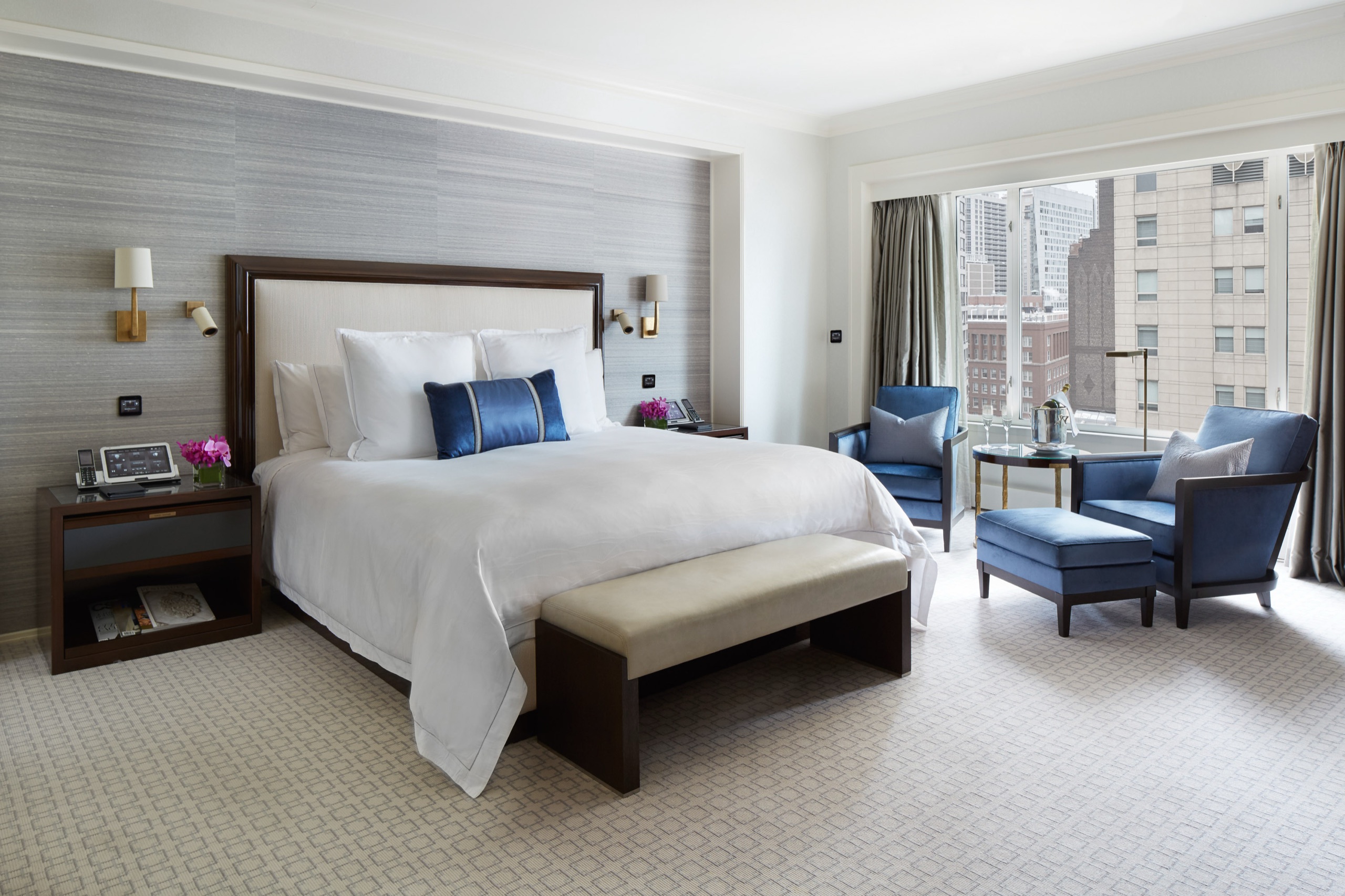 The Peninsula Suite, living room with fireplace and sectional
