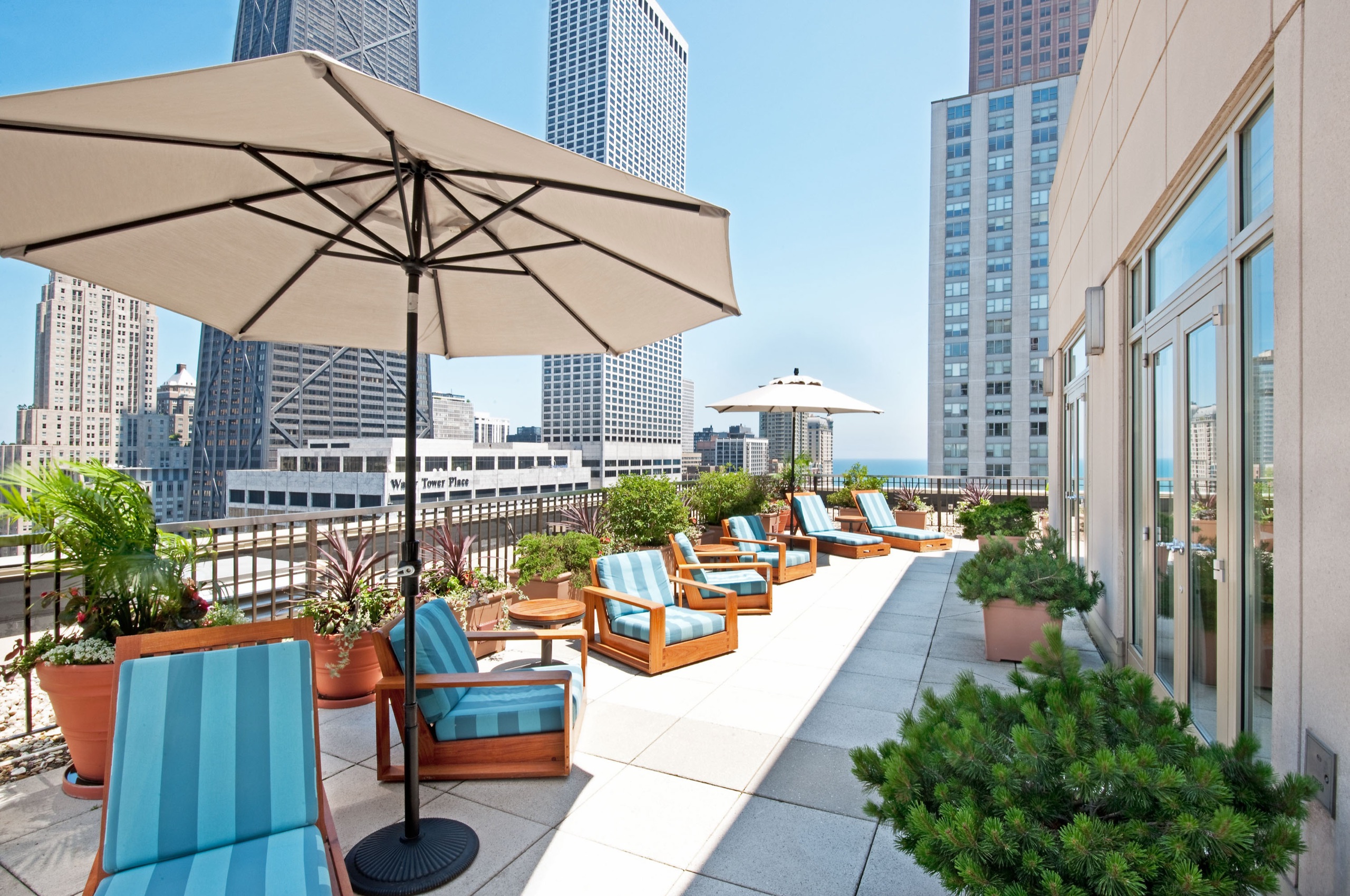 Lake Suite, sitting area with telescope and floor-to-ceiling skyline windows