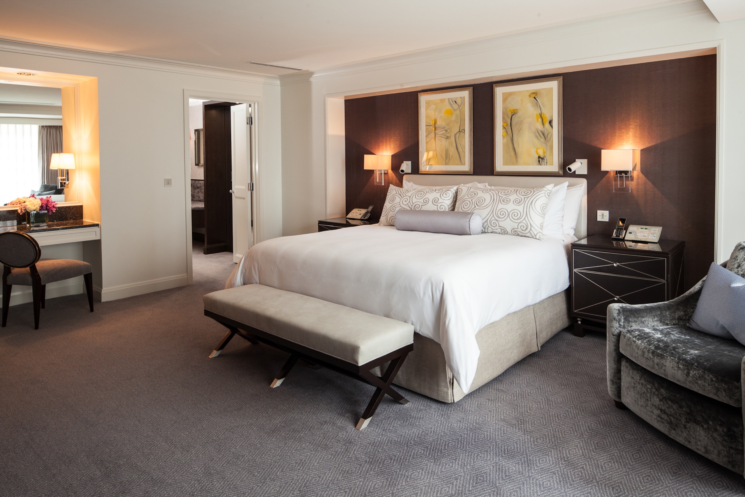 Premier junior suite bedroom with backlit art-glass screen