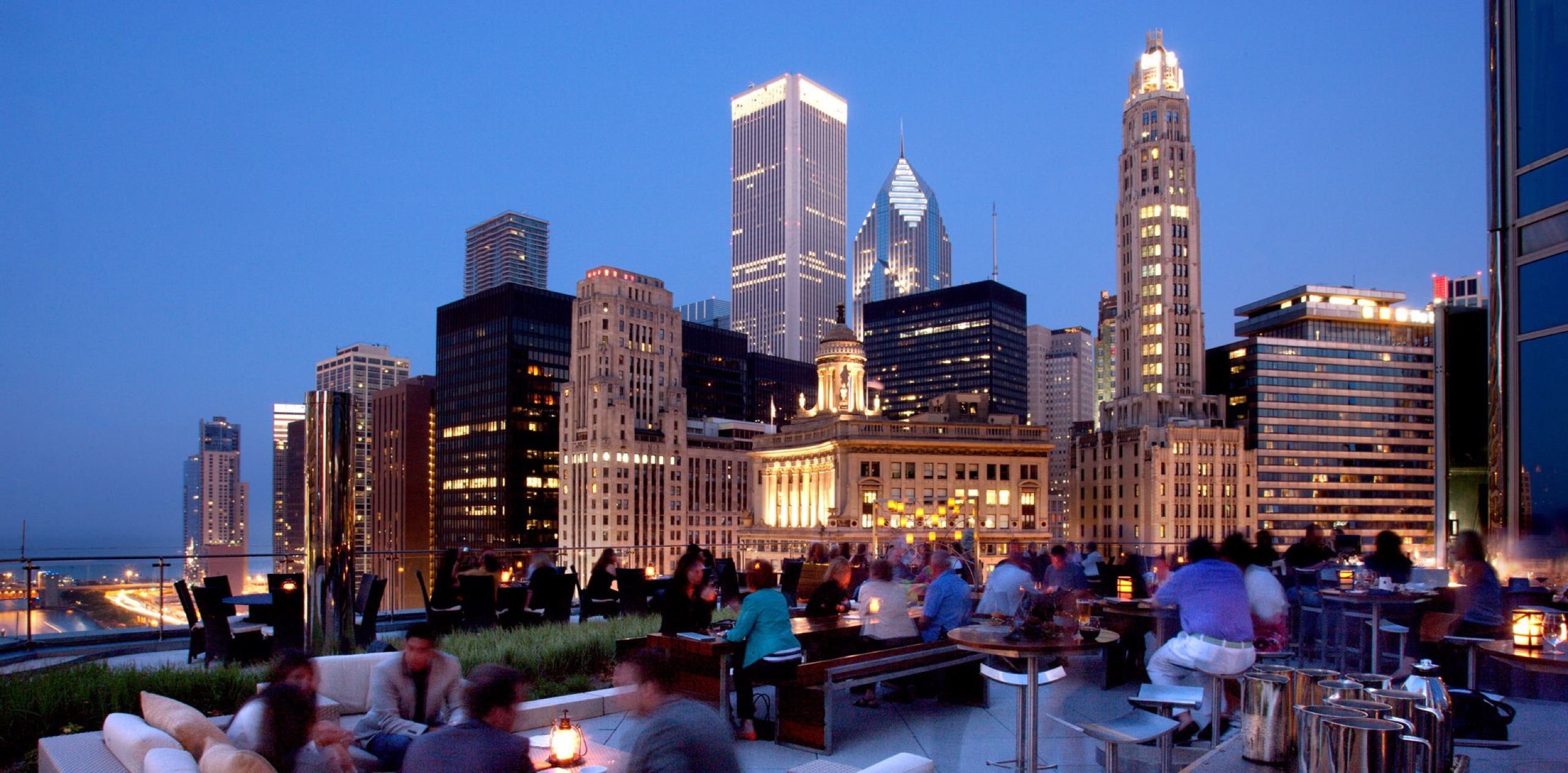 The Terrace at Trump, 16th-floor outdoor dining at dusk with skyline