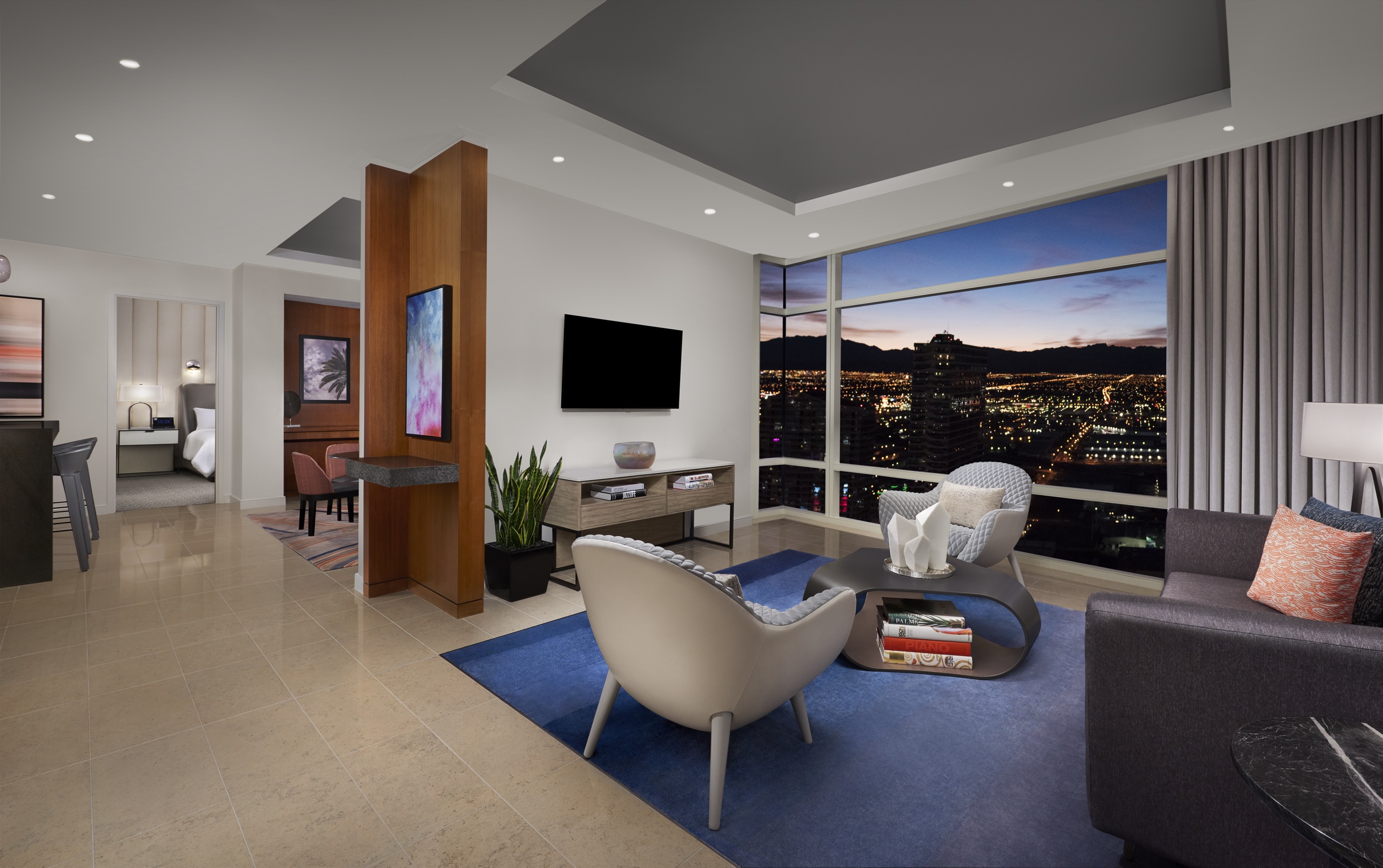 ARIA Sky Suites One Bedroom Panoramic — living room with bedroom beyond and Strip view