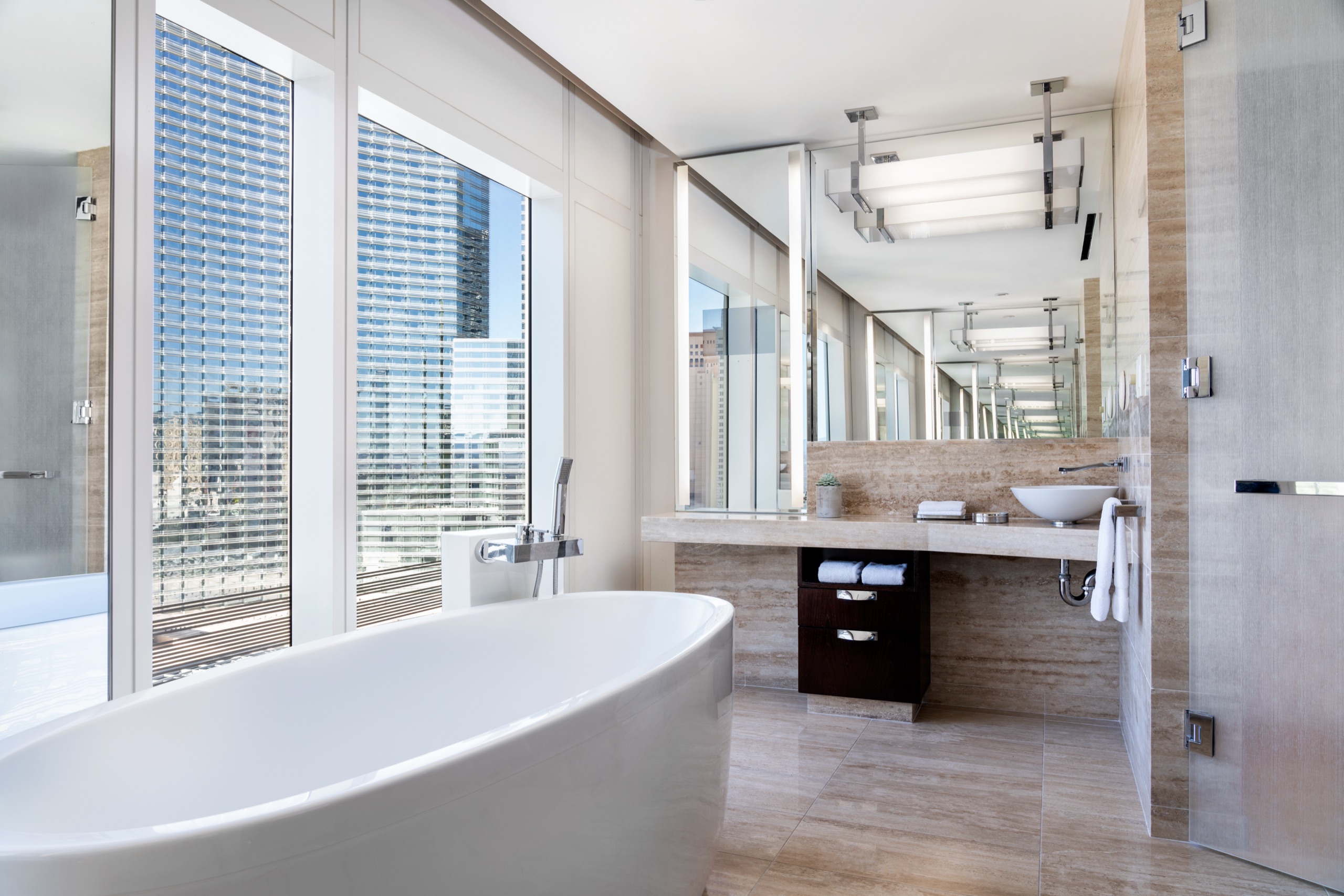 One Bedroom City View Suite - bedroom with mountain and city views (2023 redesign)