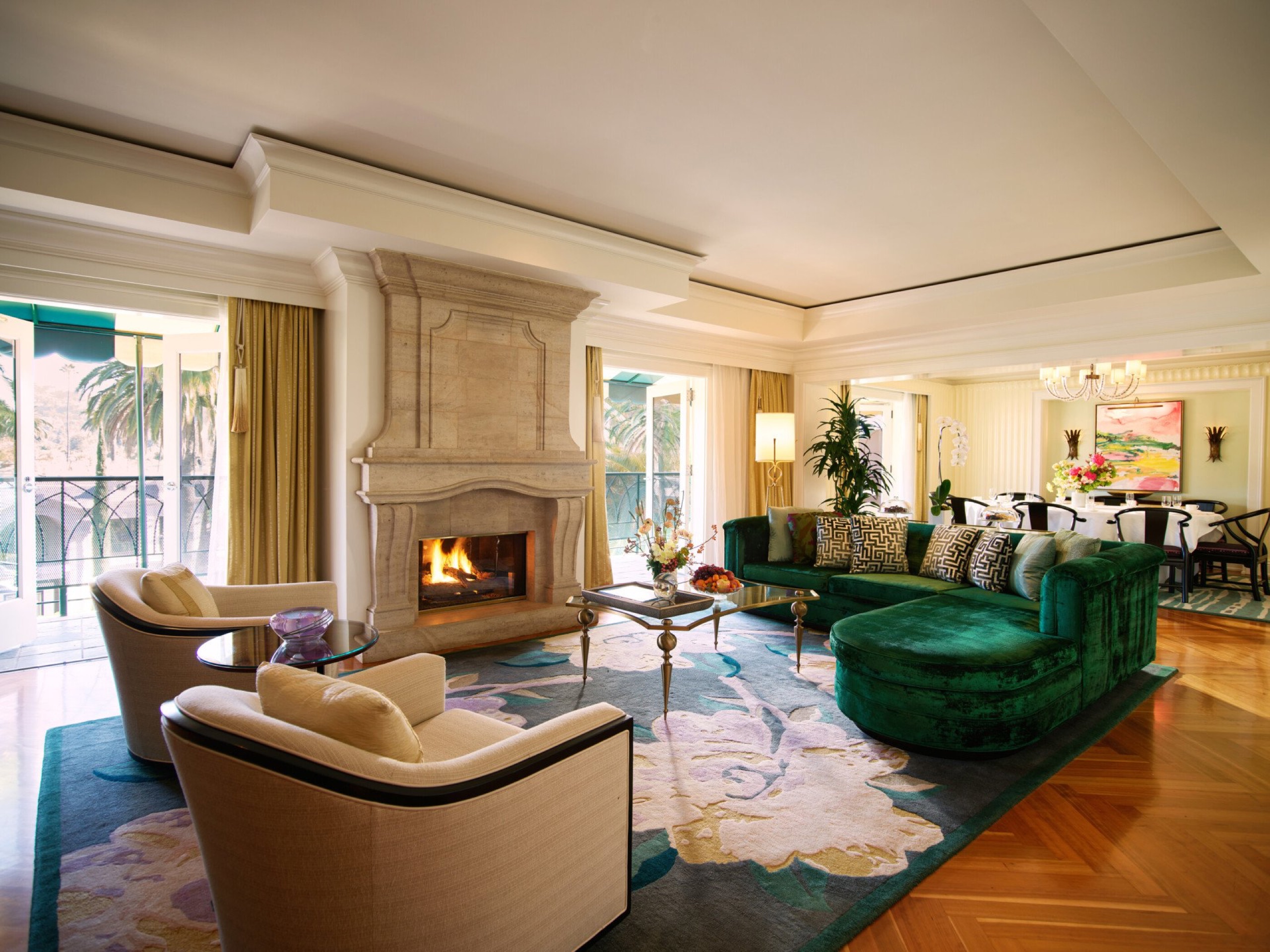 Paul R. Williams Suite (Suite 117) — living room with grand piano and stone fireplace