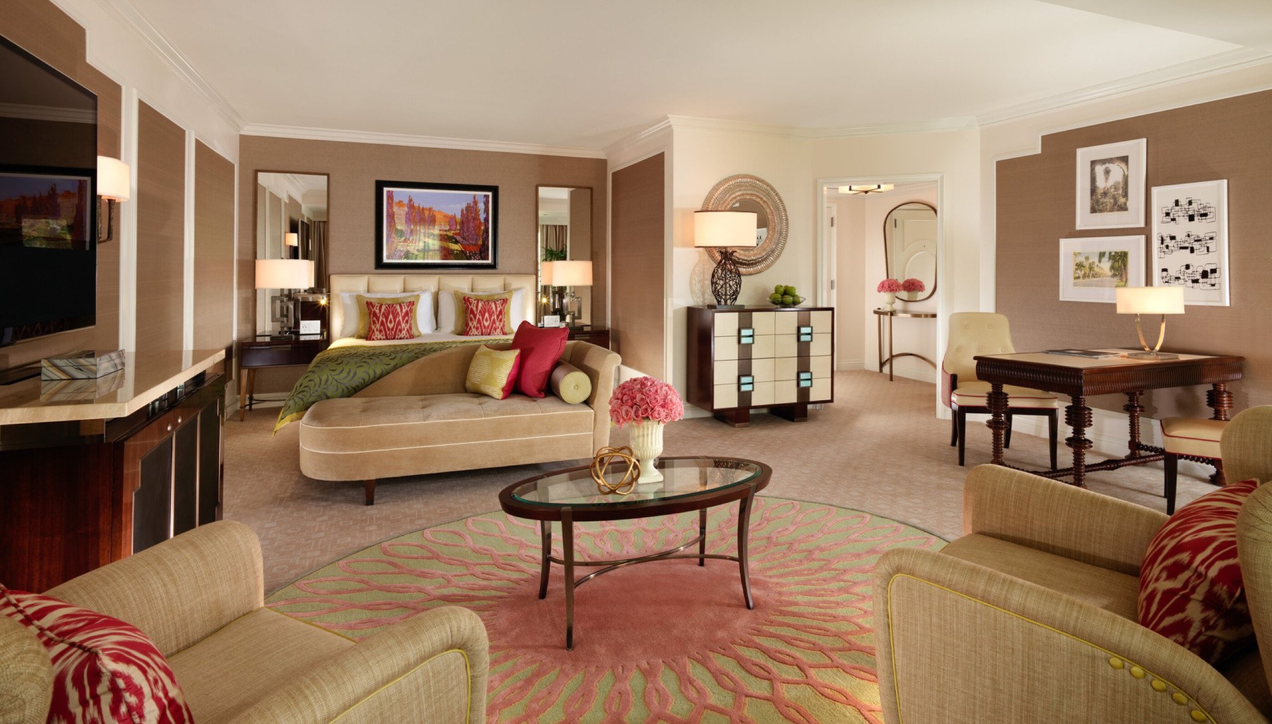 Grand Deluxe Suite living room with lavender armchairs and terrace doors