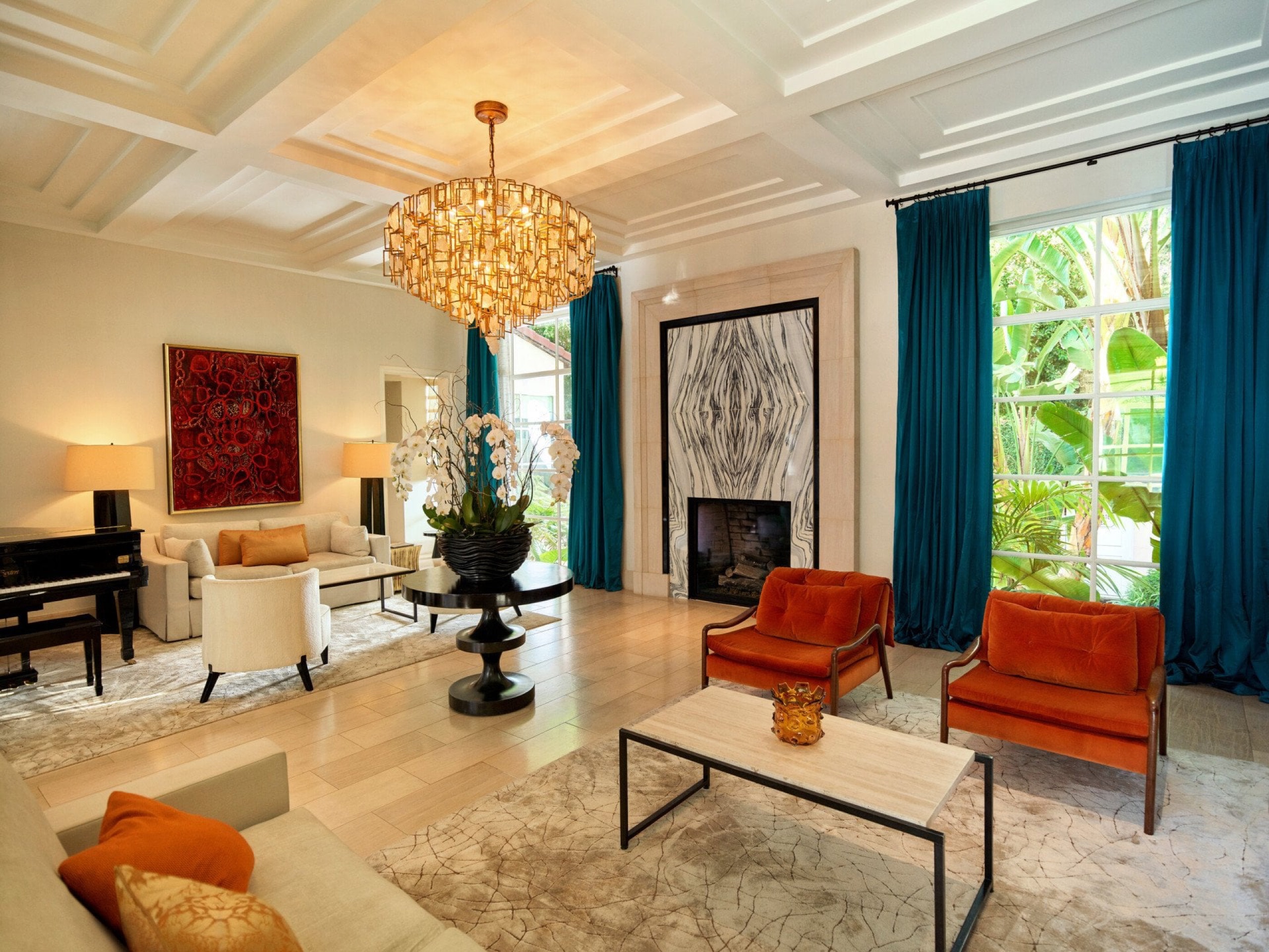 The Bell Suite living room with vaulted carved-wood ceiling and chandelier