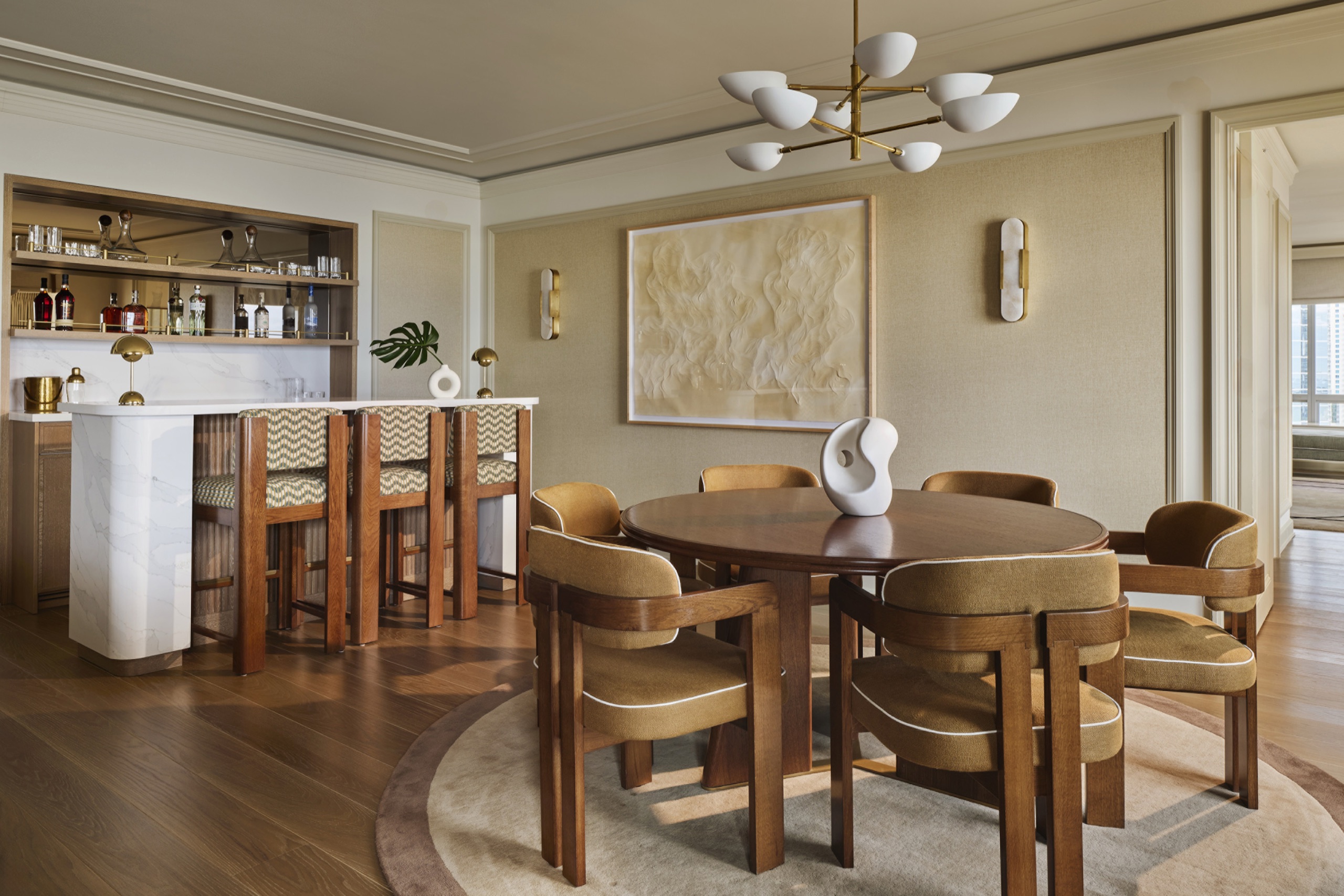 Bayfront Presidential Suite — circular dining table and Calacatta marble bar
