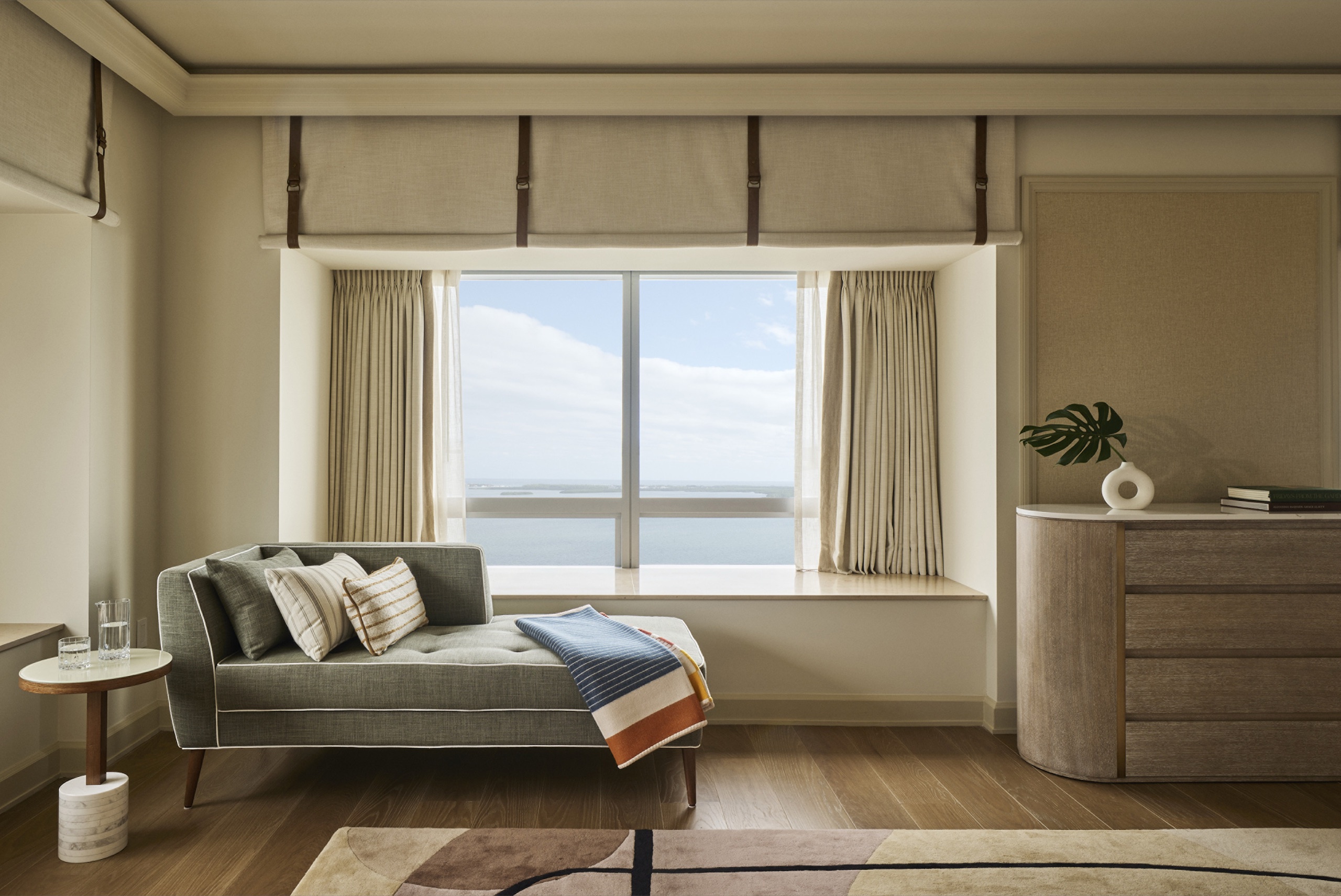 Bayfront Presidential Suite — bedroom sofa corner over the bay