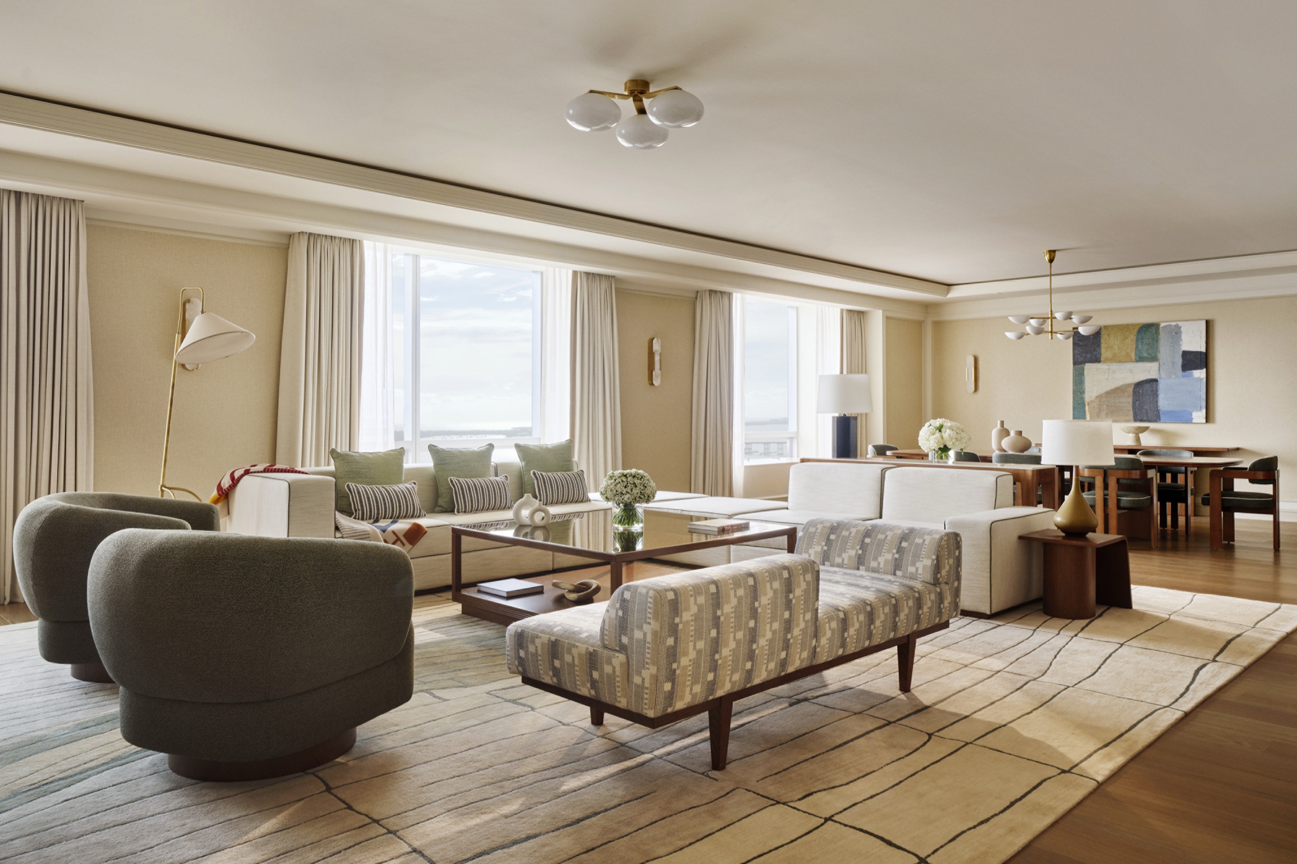 The Penthouse — living room with sculptural chairs, 29th floor