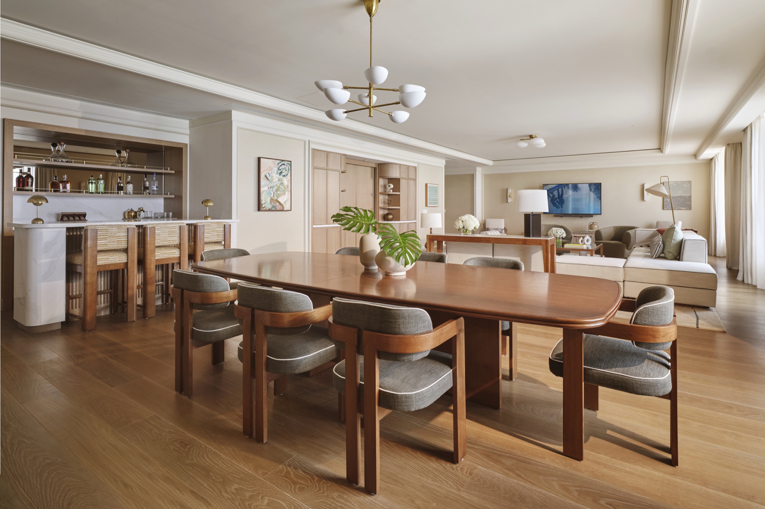 The Penthouse — dining table and Calacatta marble bar