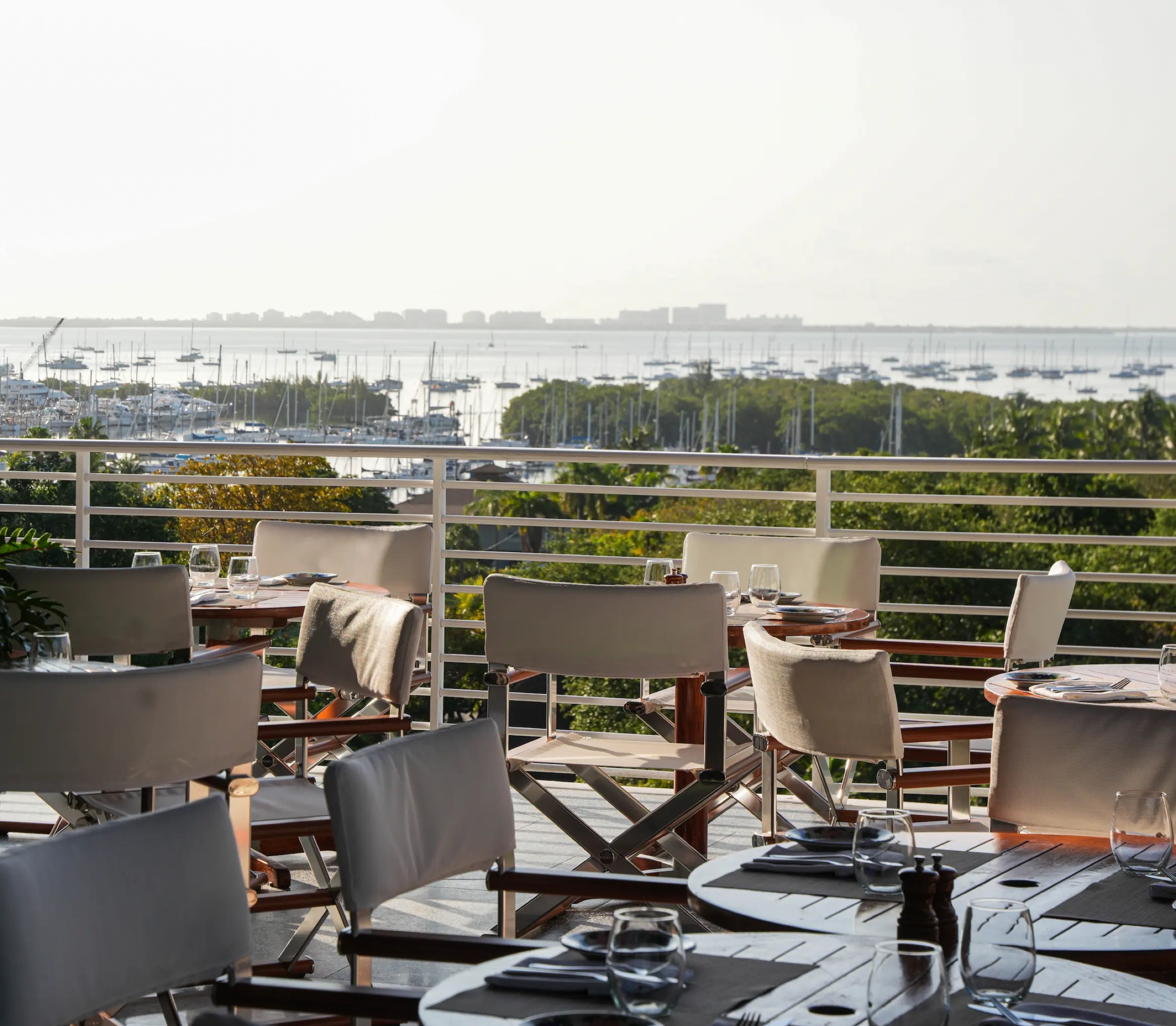 Bellini terrace tables overlooking Dinner Key Marina and Biscayne Bay