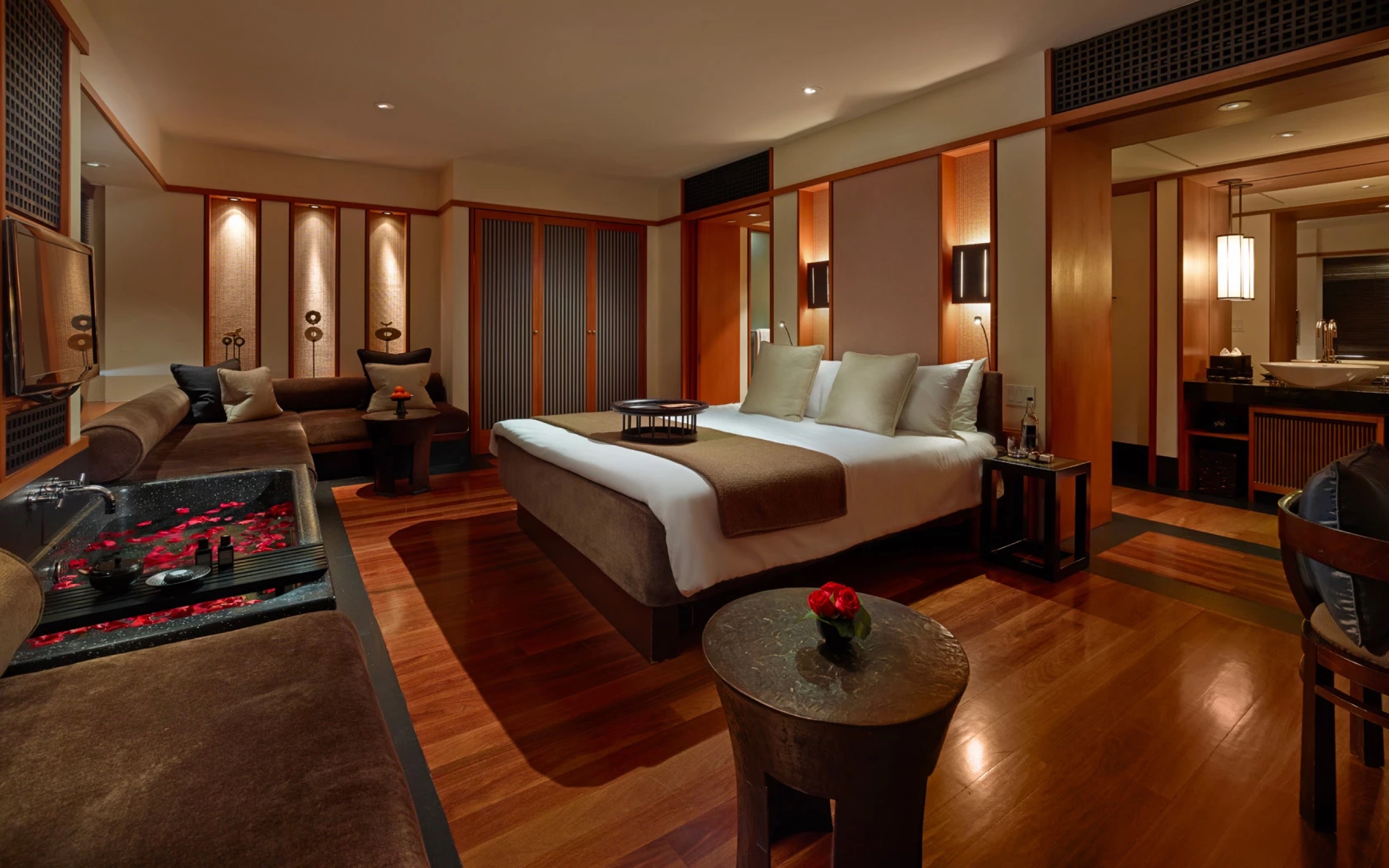 Art Deco Studio Suite - bedroom with lounge and petal-strewn soaking tub