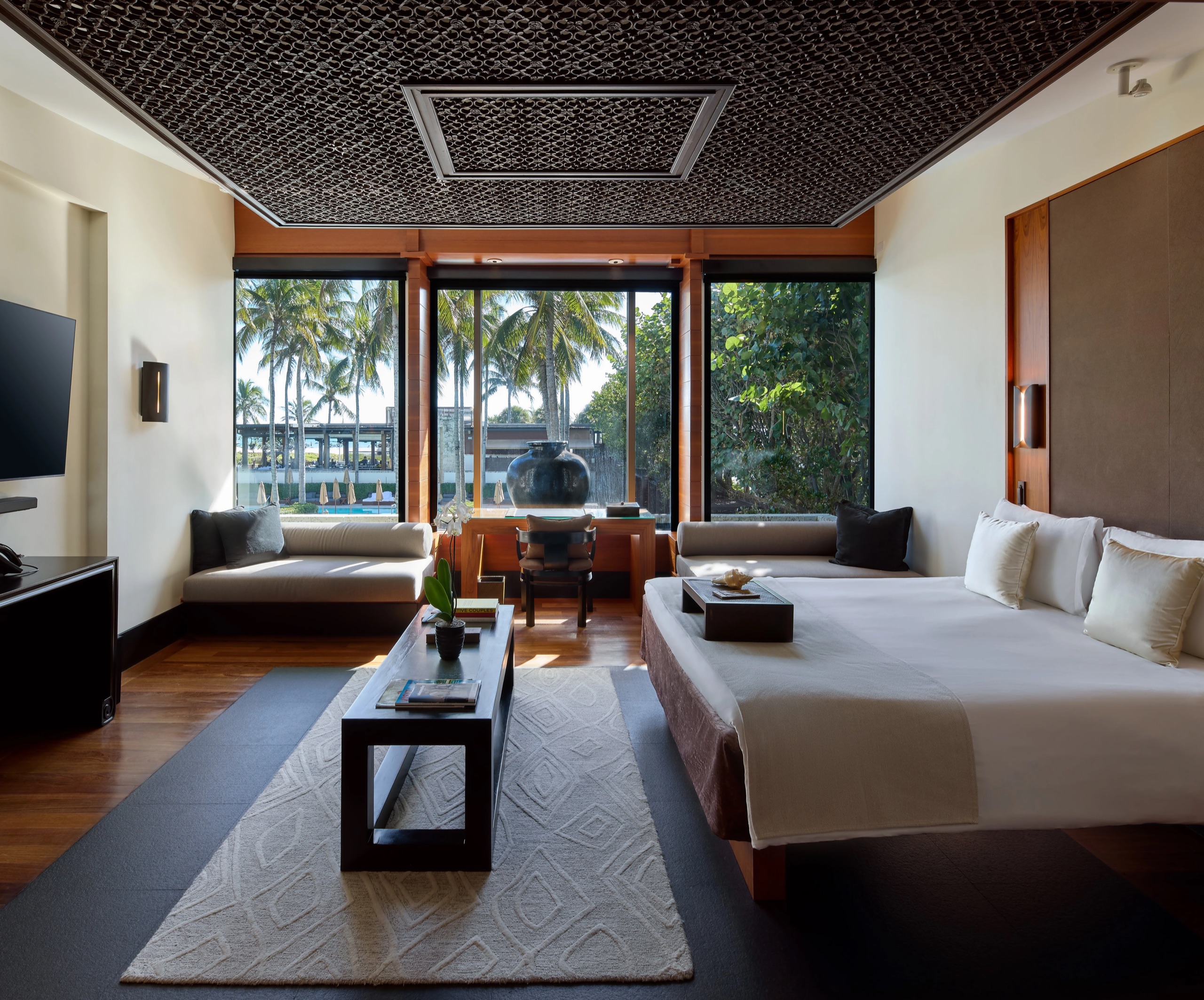 Pool Villa - twin-bed configuration opening onto the courtyard palms
