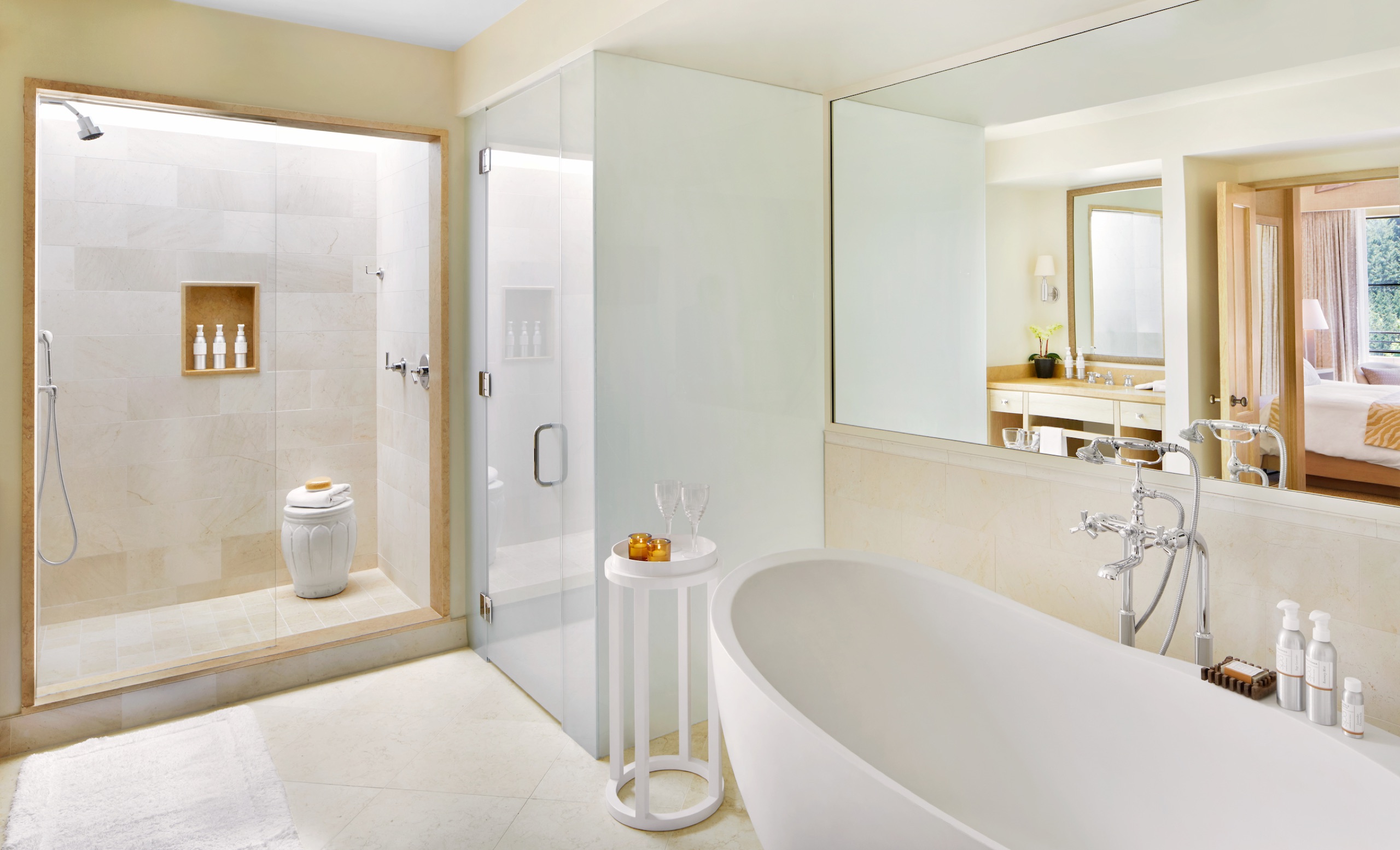 Guest room bathroom with freestanding soaking tub and walk-in rain shower