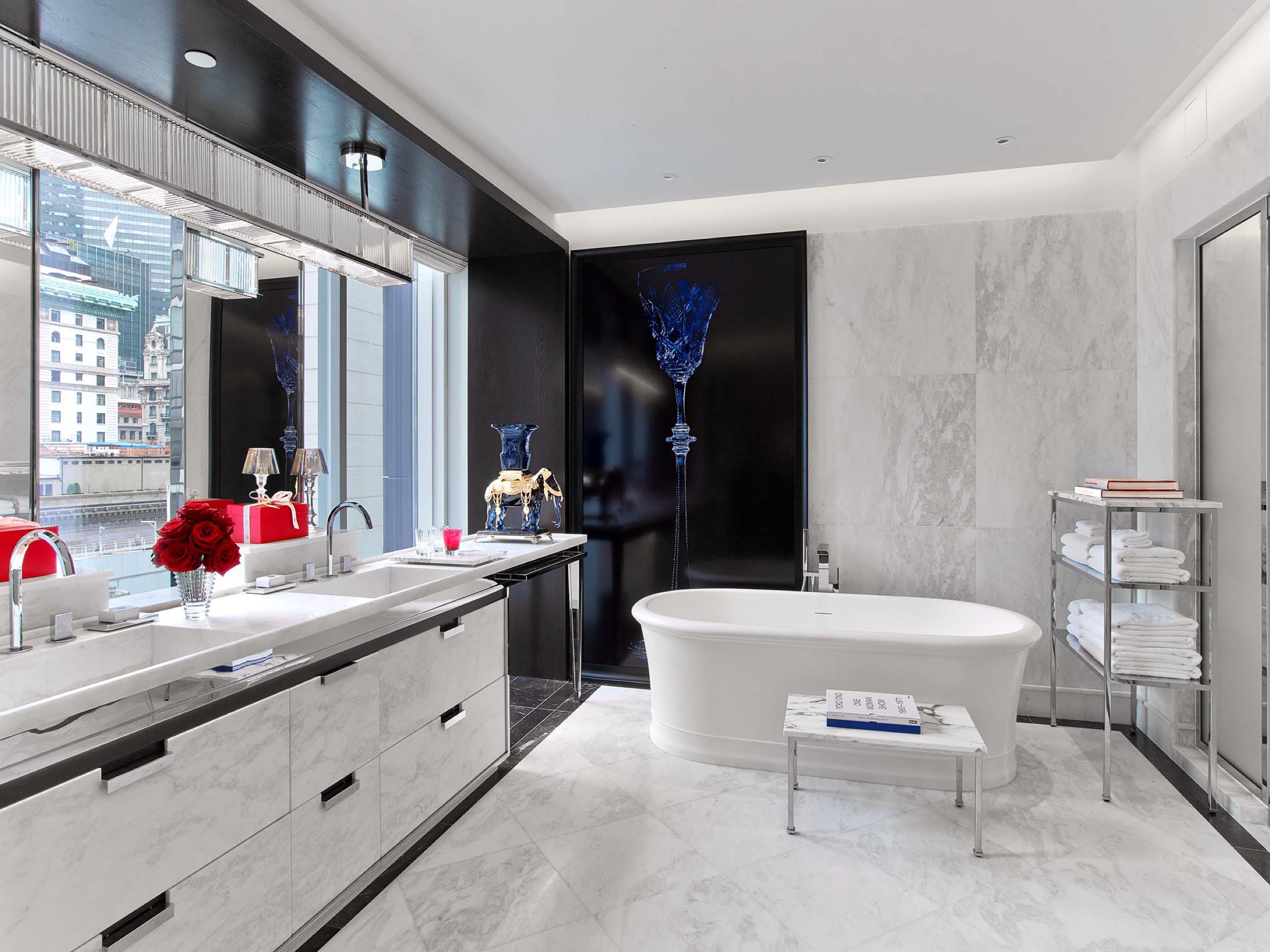 Baccarat Suite bedroom with open marble bath