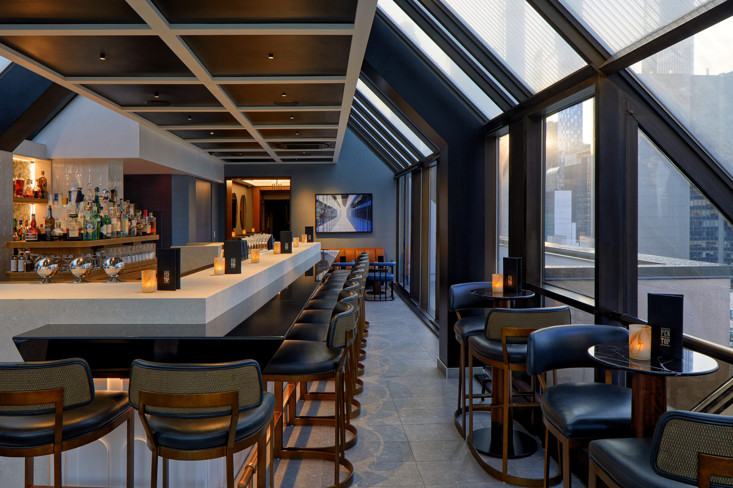 Pen Top - the reimagined 23rd-floor rooftop bar, interior bar beneath the glazed roof (2024)