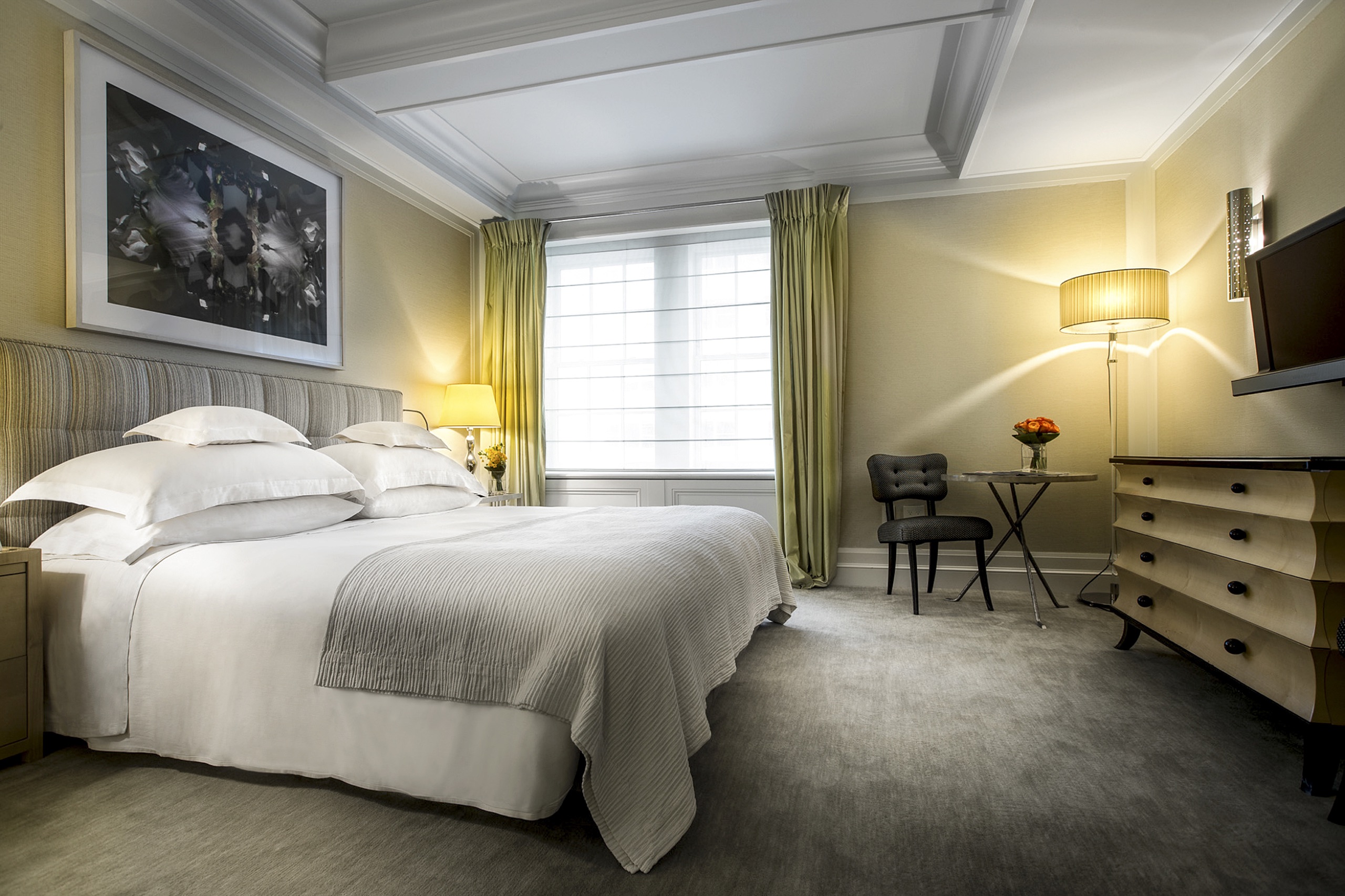 Madison King guest room with Jacques Grange striped headboard and city window