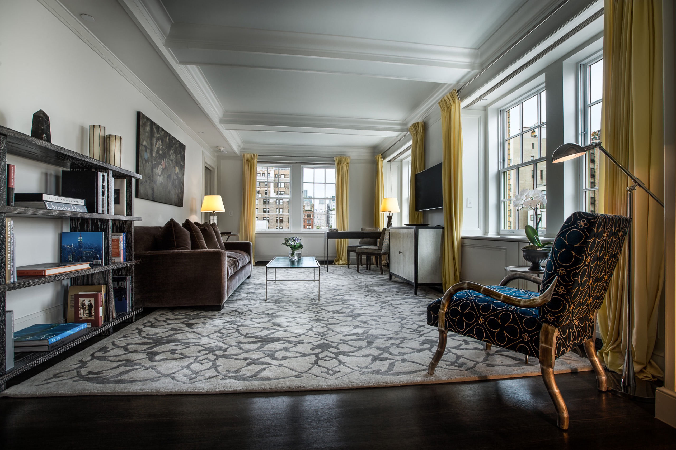Two-Bedroom Premier Suite living room with library wall