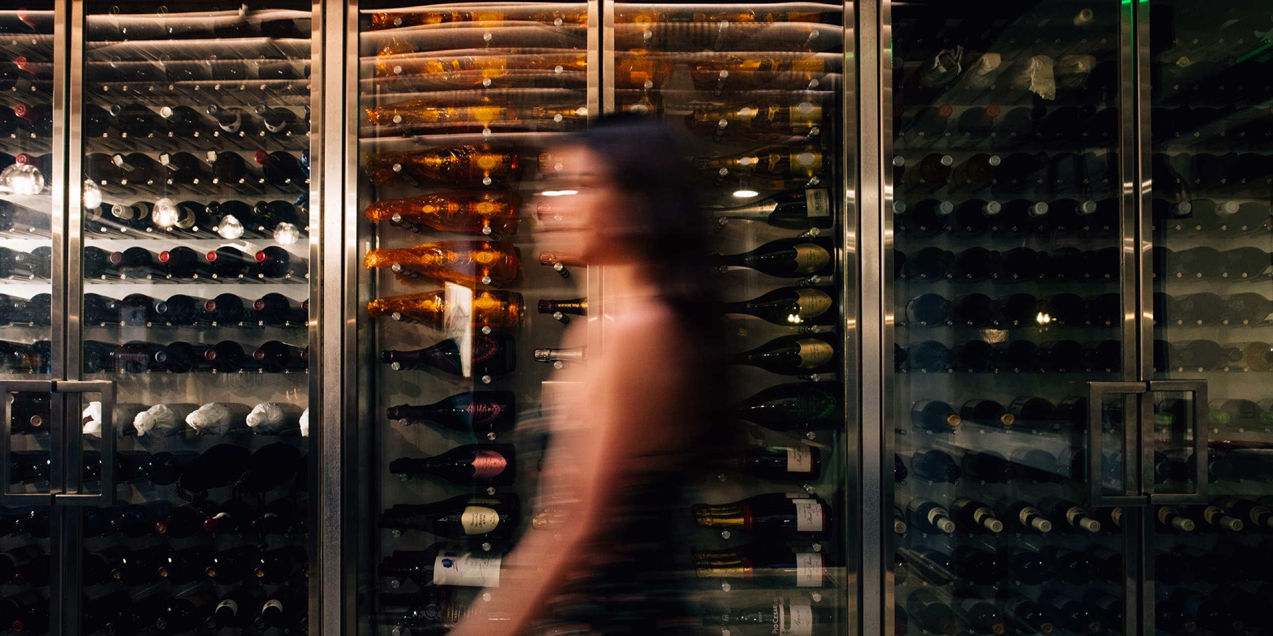 Mugen wine wall - floor-to-ceiling cellar behind the bar