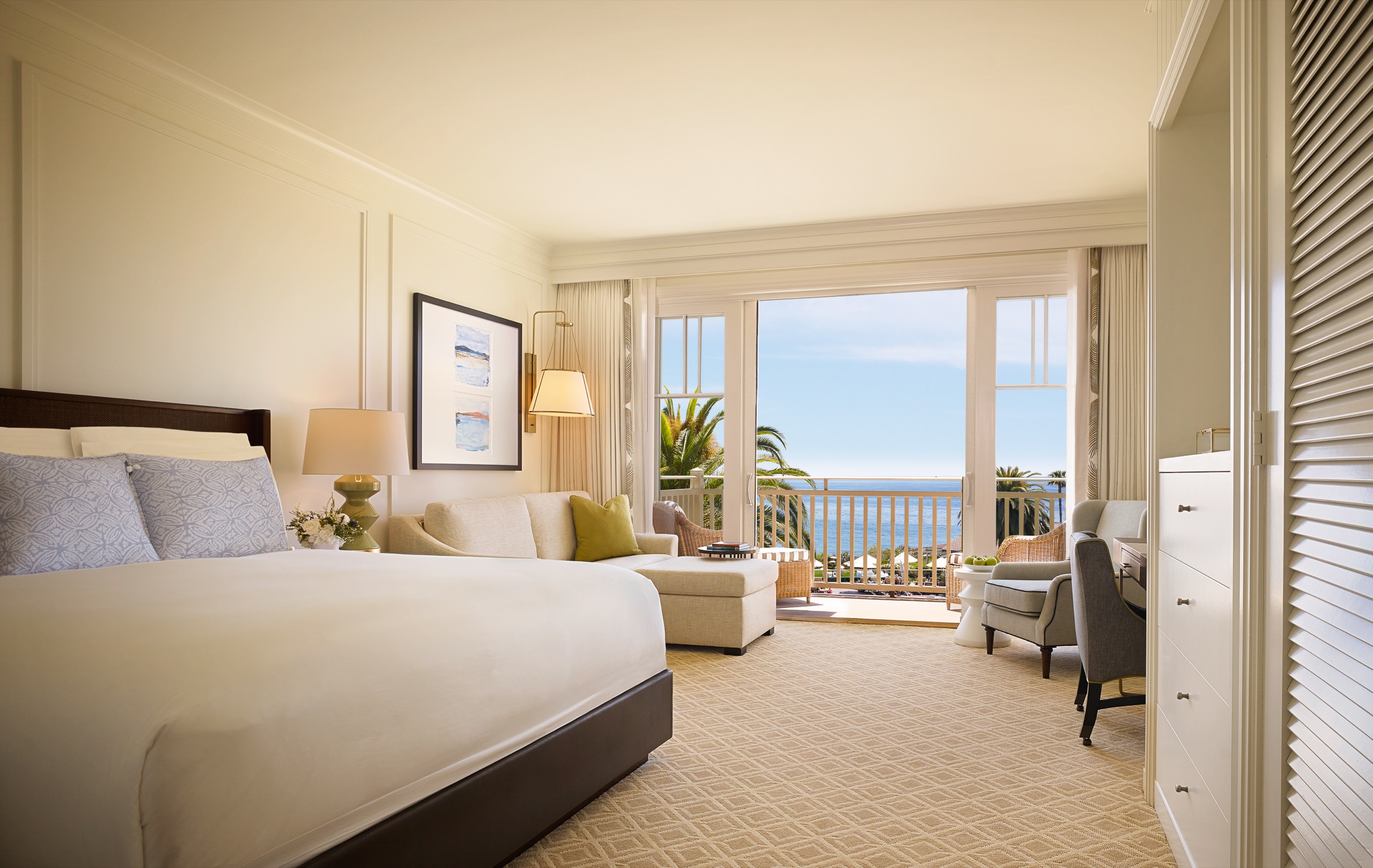 Ocean View King Room — king bed opening to a private ocean-view balcony (Coastal palette)