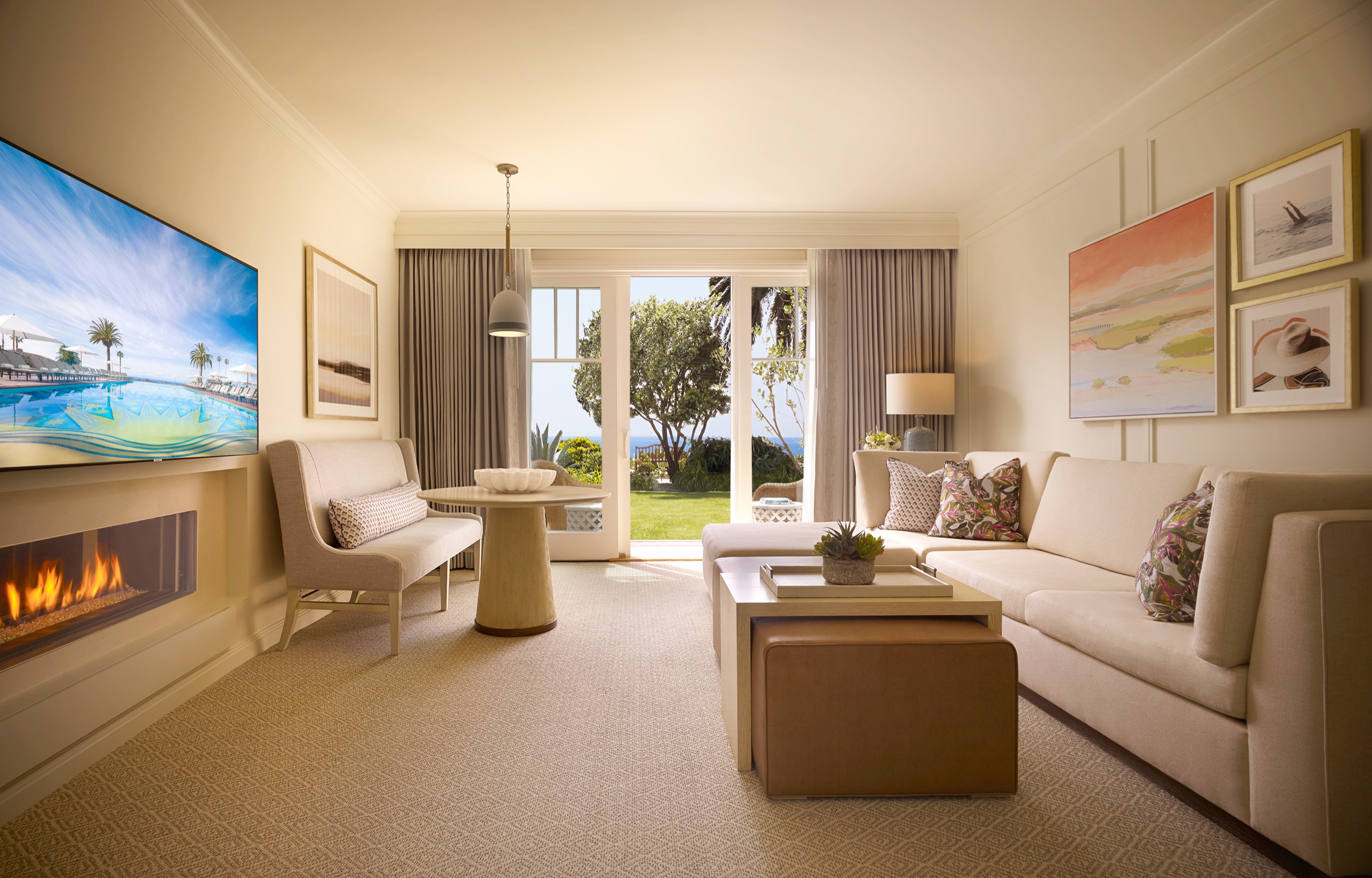 Bungalow Suite — beach-house living room with gas fireplace and garden/ocean doors (Horizon palette)