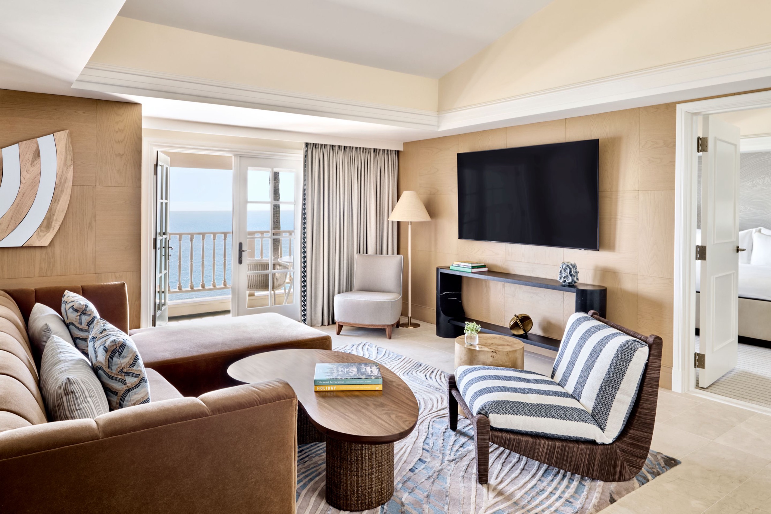 Headlands Suite living room with ocean-view balcony (two-bedroom, 1,620 sq ft)