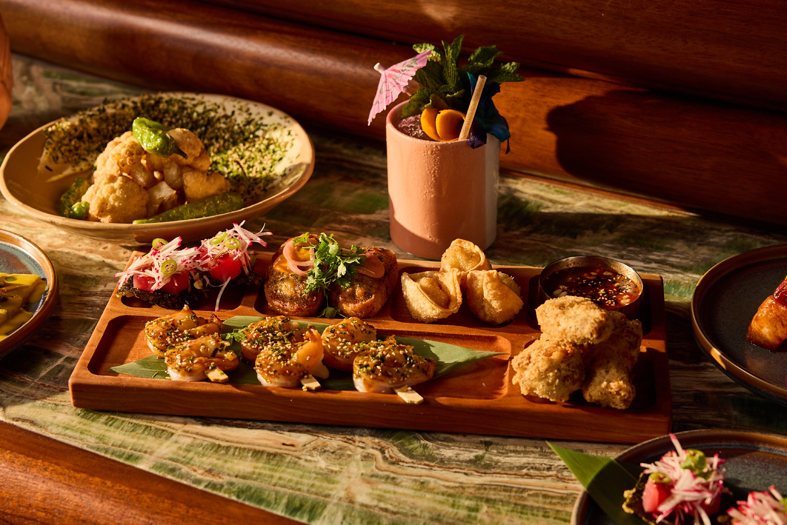 Papaya Club - Paul McGee Polynesian cocktail with Asian-inspired sharing plates