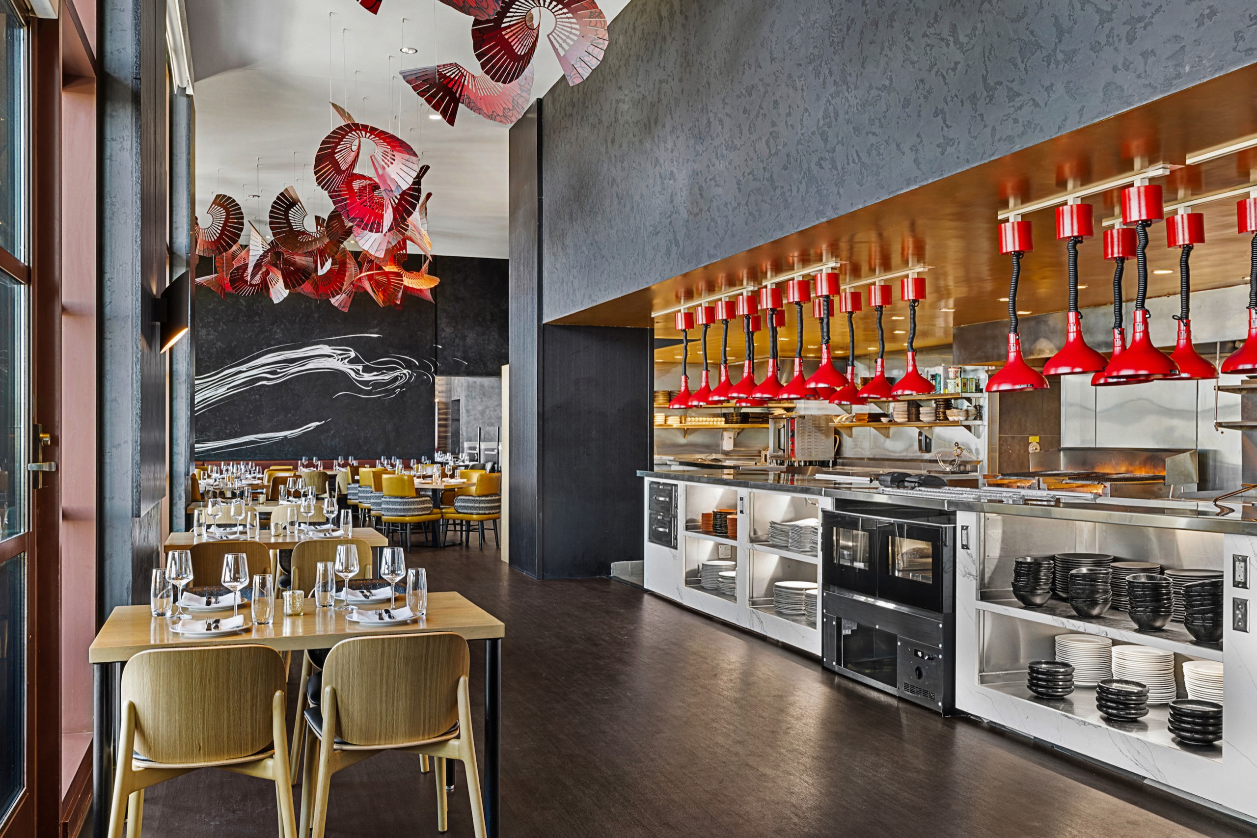 Capa Steakhouse dining room with view of the open kitchen