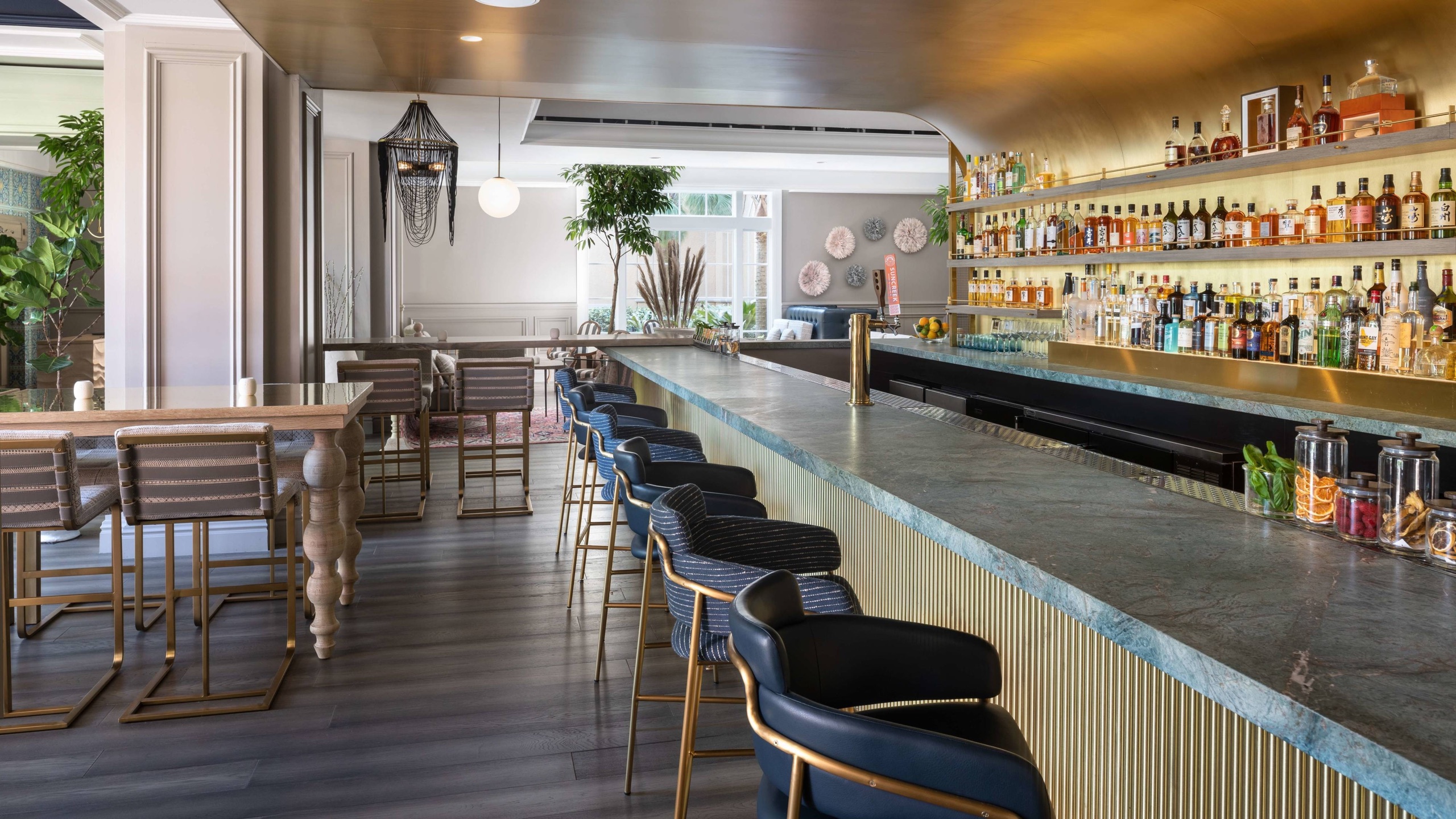 Knife & Spoon bar (Michelin-starred steakhouse) with marble counter and back bar