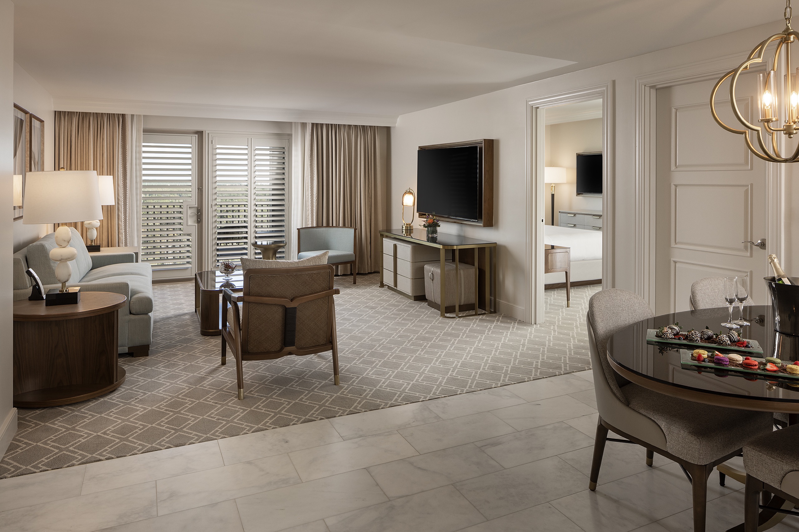 Luxury Suite (corner suite, 1,460 sq ft) living area with golf and preserve views