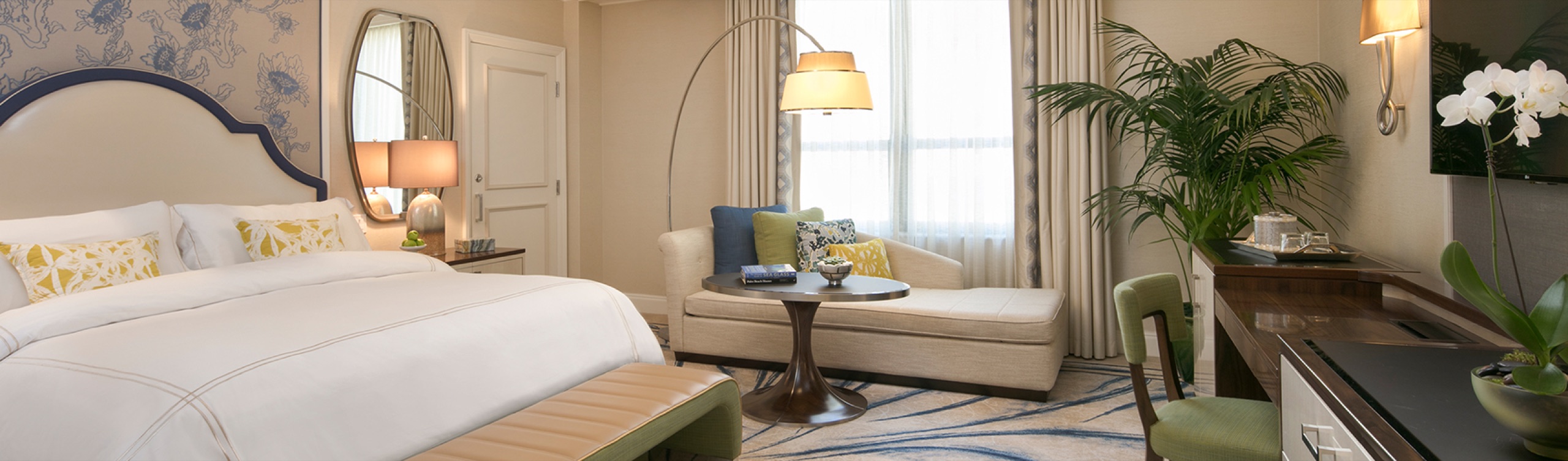 Premium Guest Room with Resort View, king bed with blue-and-white headboard and seating area