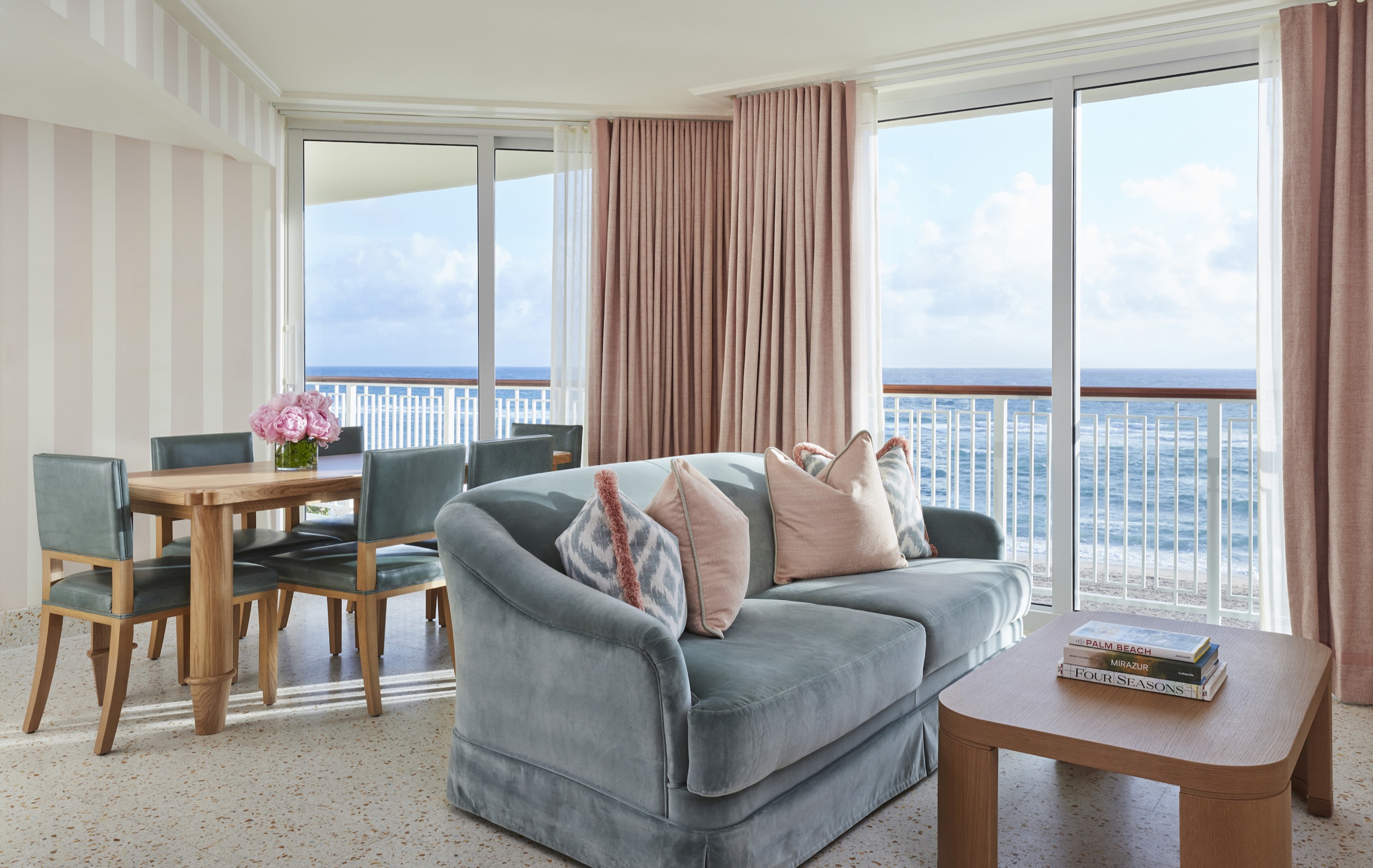 Oceanfront One-Bedroom Suite: living and dining area with striped walls and ocean balcony