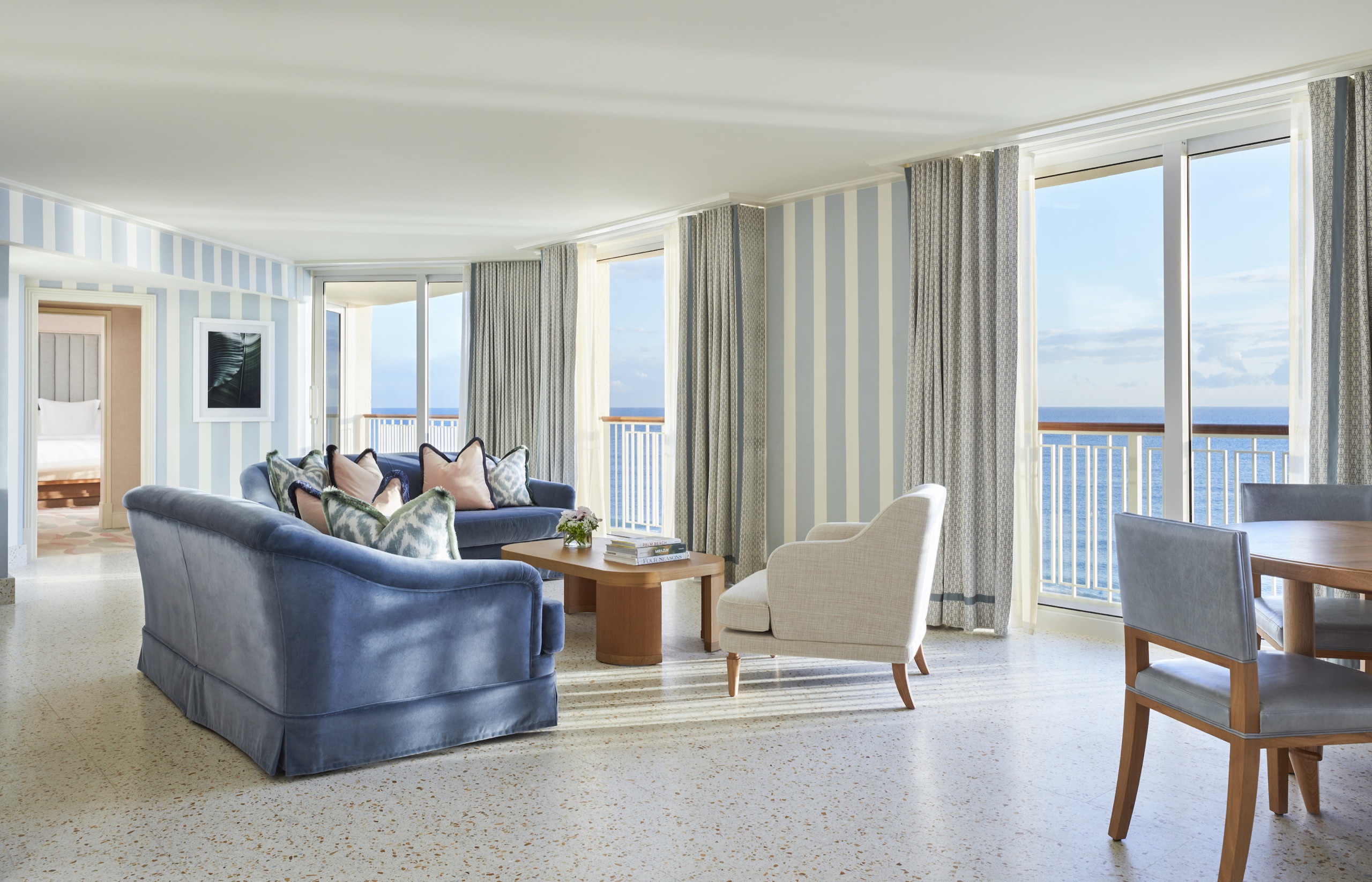 Providencia Suite: corner living room with wraparound ocean-view windows