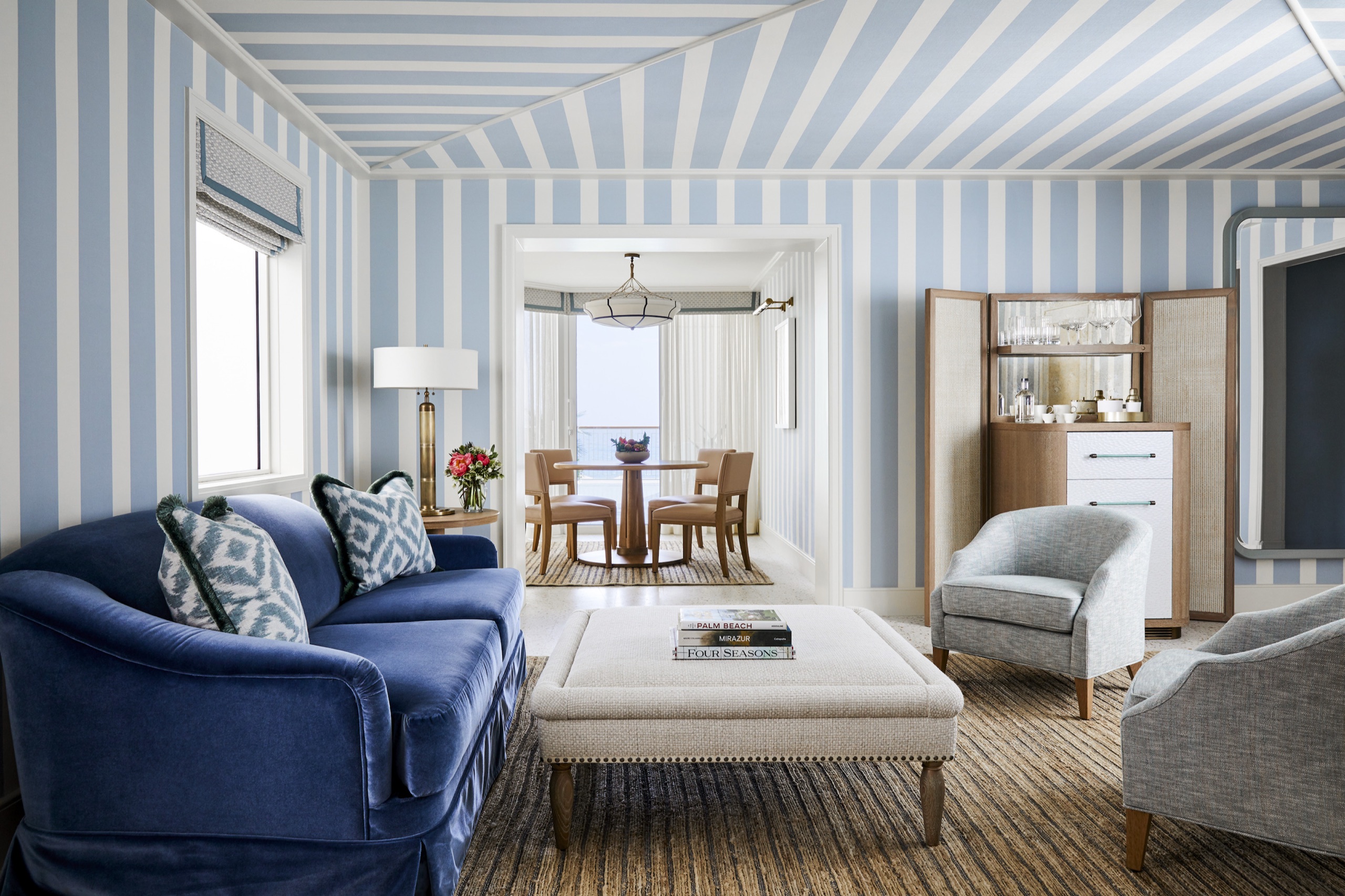 Ocean Terrace Suite: living room with blue-and-white striped walls and ceiling