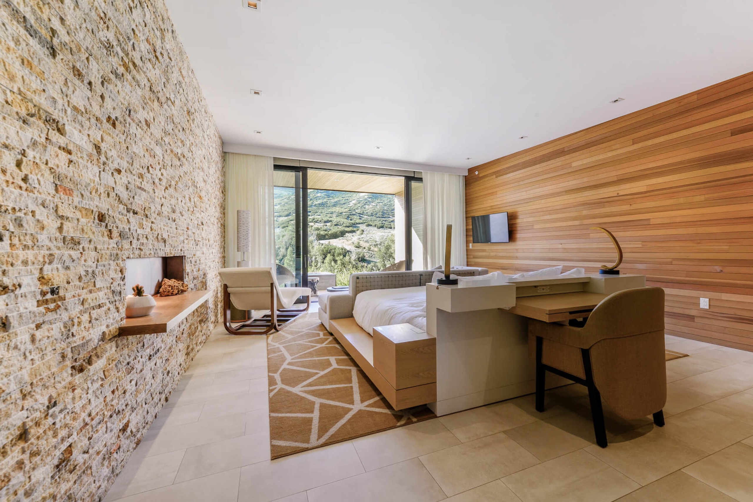 Sky Room - cedar-clad bedroom with floor-to-ceiling mountain view