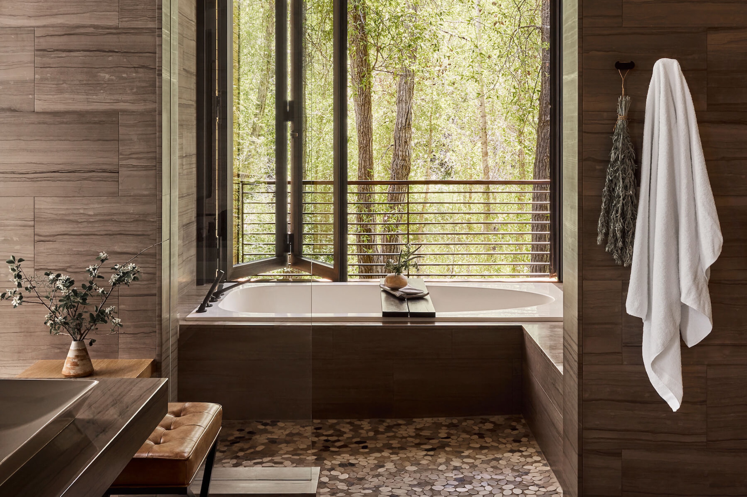 Creek House - standalone creekside cabin bedroom with fireplace
