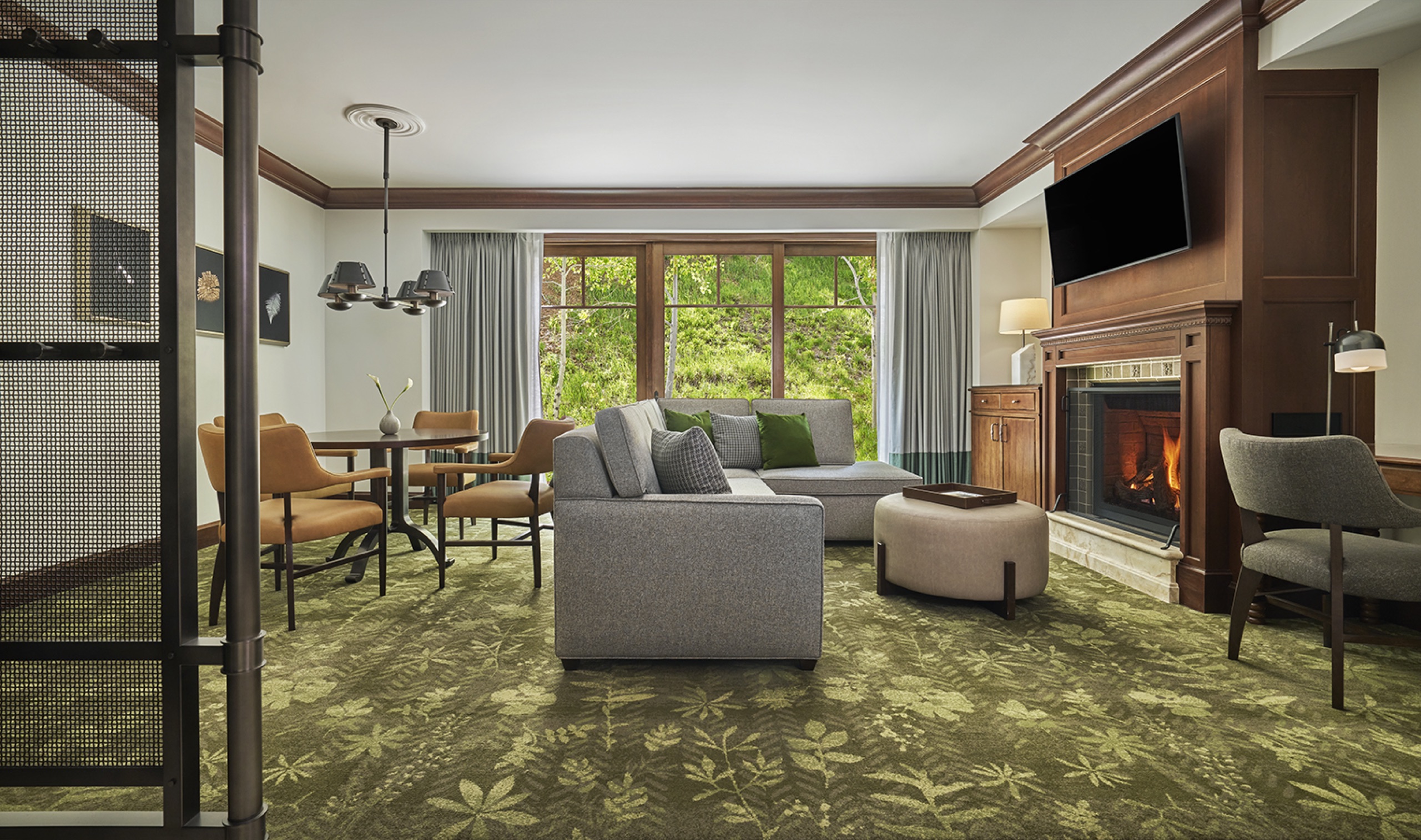 One Bedroom Suite living room with dining table and fireplace