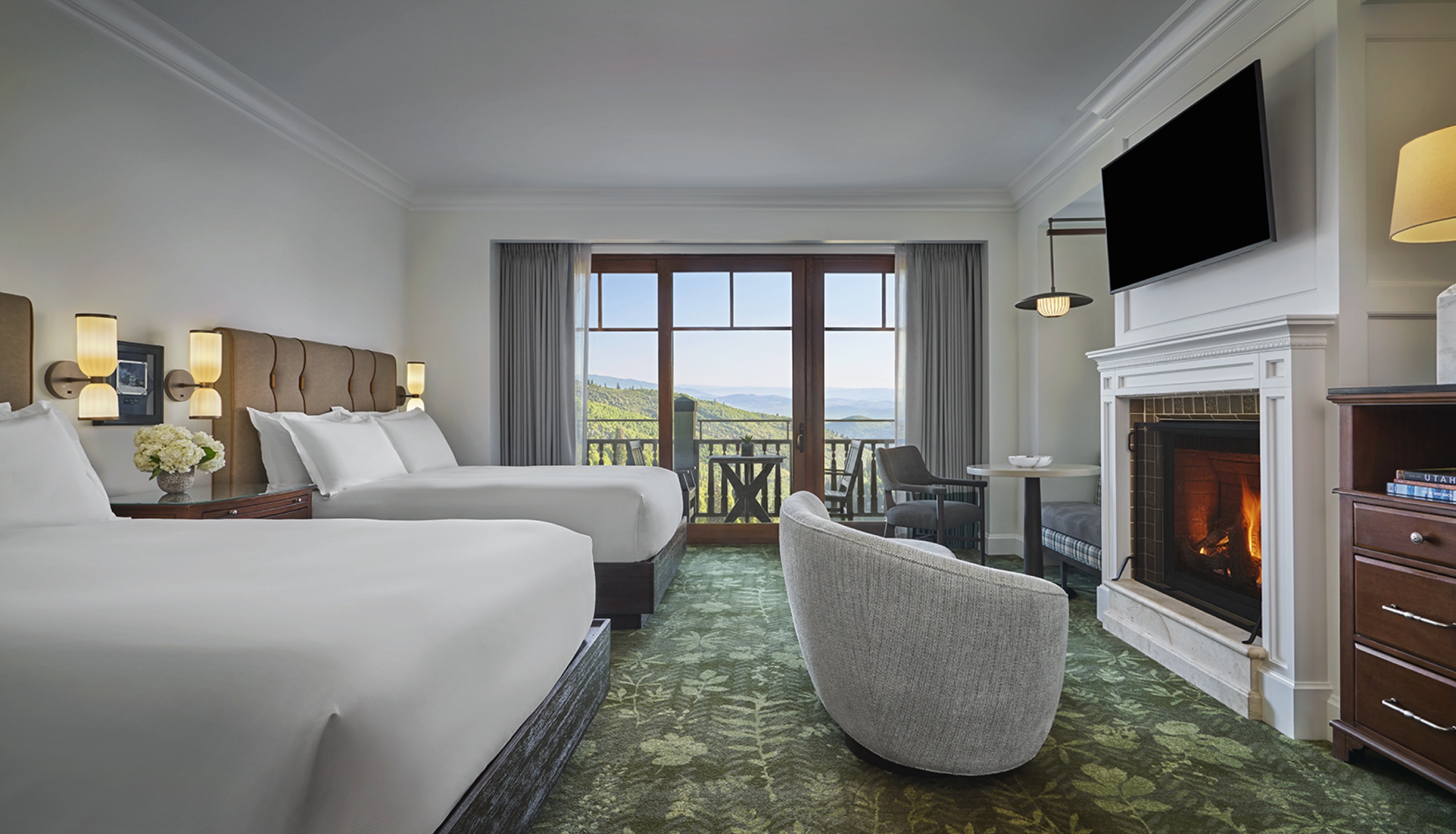 Peak View Queen Queen Room — two queen beds with fireplace and mountain view