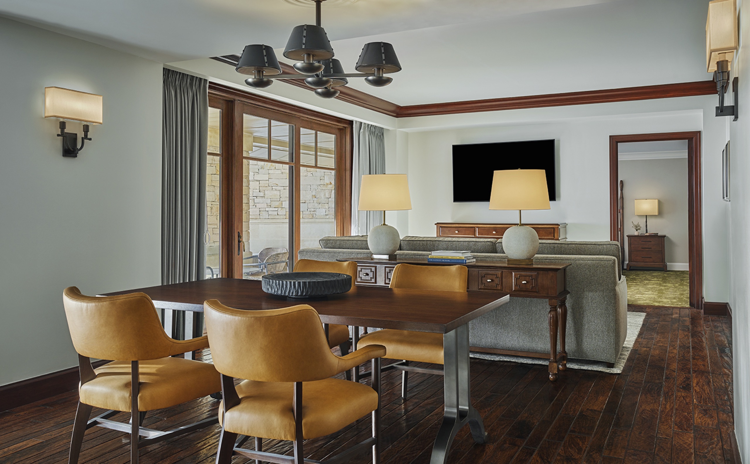 Alpine Residential Suite (1,600 sq ft) — dining and living area with patio