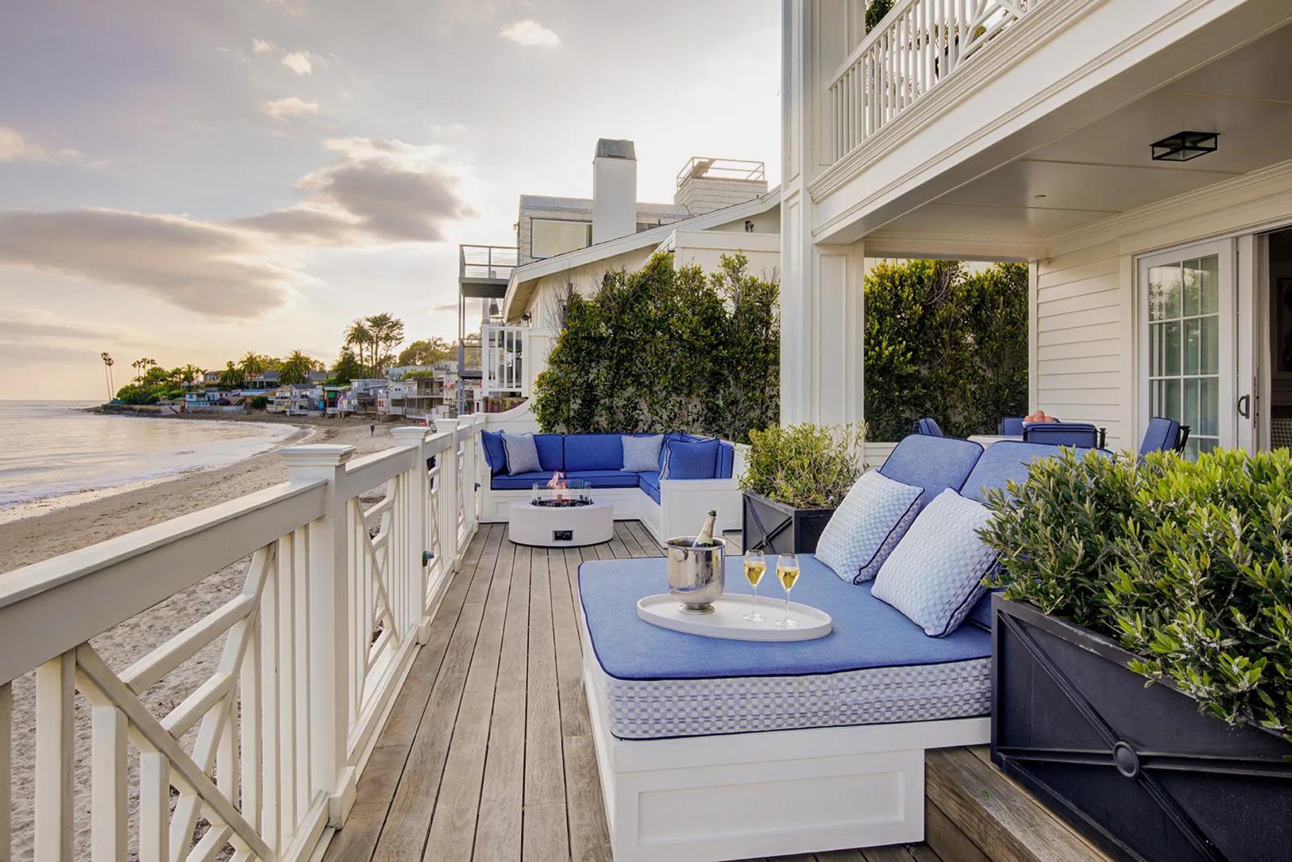 Beach House Terrace Suite private terrace with daybed and firepit over the sand