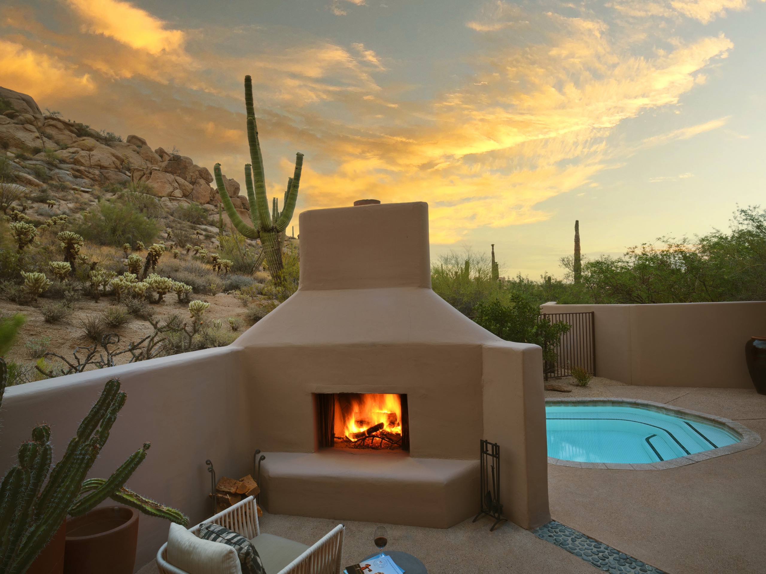 Kiva Plunge Pool Suite — plunge pool and fireplace at sunset